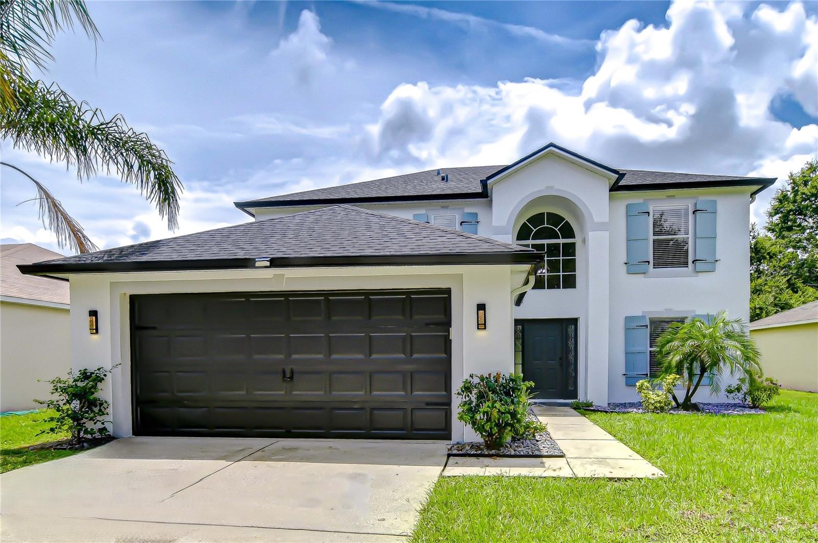 Welcome Home to this stunning move-in ready 5 BR/2.5 BA/2-car garage home in the community of King’s Lake w/ NO CDD FEES & LOW HOA FEES! RECENT UPDATES include neutral interior & exterior paint (2025), main level LVP flooring (2025), epoxy flooring in the garage (2025), ROOF w/ premium architectural shingles (2020) & A/C (2020). The spacious main level enjoys beautiful new luxury vinyl plank flooring, formal dining room w/ board & batten accent wall, a versatile 5th bedroom that could be used as an office or playroom, half bath & French doors to the huge 21x10 screened lanai w/ a gorgeous view of the pond w/ fountain. The great room is adjacent to the open kitchen featuring granite counters, tile backsplash, stainless steel appliances, recessed lighting, pantry, built-in shelving, wine rack & space for an island or dinette. Additional storage space is located under the staircase. The primary bedroom features a board & batten accent wall and barn door access to the ensuite bath w/ quartz counters, dual vanities, garden tub, separate walk-in shower and spacious His & Her walk-in closets. 3 additional bedrooms and a 2nd full bath round out the upper-level floorplan. The exterior of the home has been recently professionally painted and features an irrigation system and productive fruit trees (MANGO & GRAPEFRUIT). The community of King’s Lake features a park, playground, basketball court & dog park and is super-conveniently located close to everything in the Big Bend/Hwy 301 area and only minutes from I-75, I-4, Selmon Crosstown Expressway, MacDill AFB, schools, shopping, dining, entertainment, beaches, hospitals, theme parks & all the Tampa Bay area has to offer! Don’t miss out on the chance to make this beautiful property your own…schedule a showing today!