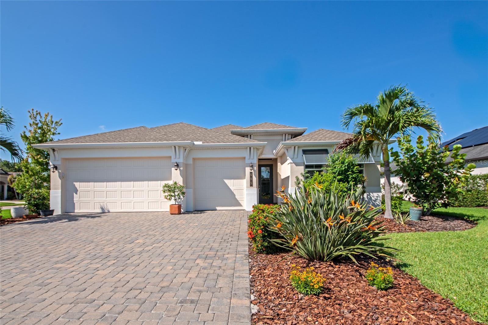 From the moment you arrive in the coveted community of Greyhawk Landing, you'll feel the difference. This beautifully appointed "Captiva" 3 car garage model by Sam Rogers offers a rare opportunity to embrace the Florida lifestyle you've been dreaming of. As you step inside, you are greeted by an expansive great room where soaring volume ceilings and an open-concept design create a breathtaking first impression of light and space.
The true heart of this home is the gourmet kitchen, a culinary haven where family and friends will naturally gather. A commanding center island provides ample space for meal prep and casual dining, complemented by timeless wood cabinetry, a full suite of stainless steel appliances, and the highly sought-after natural gas cooktop.
The living space extends effortlessly outdoors to a private, screened lanai—the ideal setting for savoring quiet mornings or hosting lively weekend barbecues. Enclosed by lush, mature landscaping, the backyard is a true sanctuary, offering a serene escape and more than enough room to design the pool you've always wanted. Functionality and peace of mind are paramount, with high-impact hurricane windows installed throughout for ultimate protection and energy savings.
Living in Greyhawk Landing is an experience in itself. This premier community offers residents an active, resort-style life with the security of a gated entrance, two sparkling pools, a fitness center, scenic nature trails, and sports fields for all to enjoy. Conveniently situated in the heart of East Manatee, you are just minutes from A-rated schools and premier shopping destinations.
This home is more than a residence; it’s a lifestyle waiting to be claimed. Be sure to explore the immersive 3D walkthrough via the virtual tour link, and then contact us to schedule your exclusive showing. Your new chapter starts here!