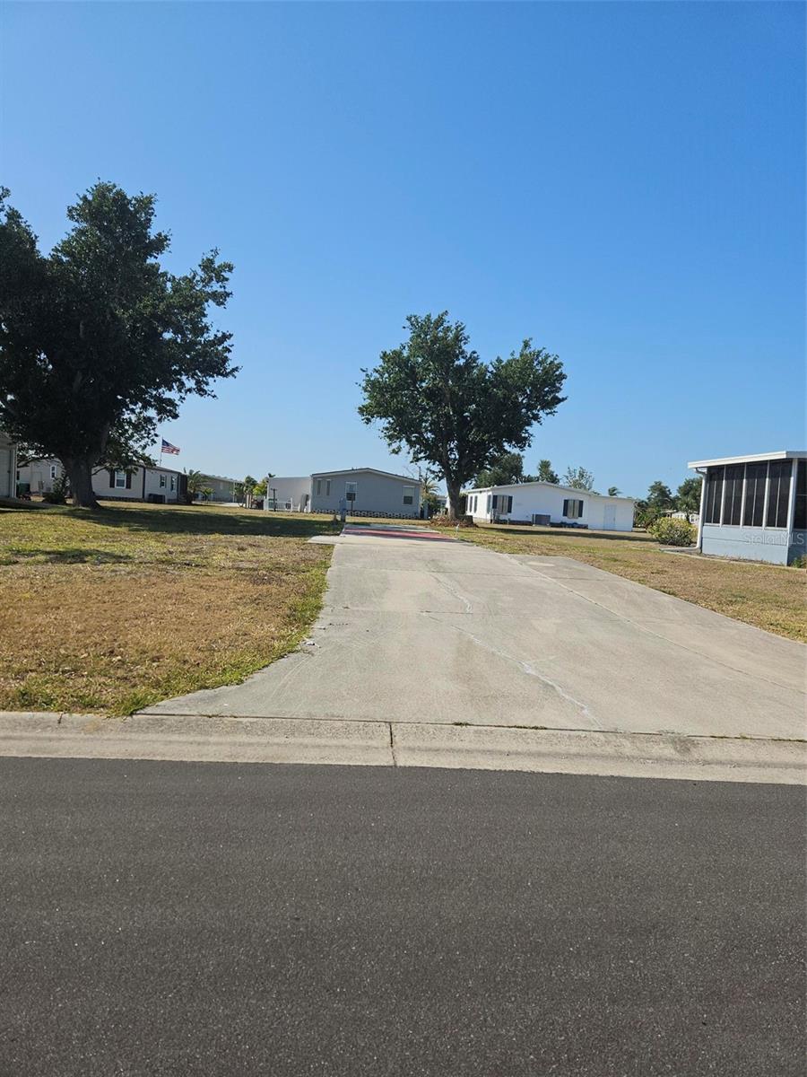 Welcome home to the sought after 55+ mobile home community of Lemon Bay Isles! This lot is waiting for you to put your new mobile here, extra long pad for many possibilities. Just a quick car or bike ride or walk to shopping, medical, dining and more. This community requires mandatory membership to the Lakeside club for a low annual fee. Enjoy swimming, tennis, socializing at as many functions as you choose. Beautifully maintained community. You are also an appx 10 minute drive to Gulf beaches and golfing venues too. Looking for an active Florida lifestyle this just may be the place for you! Take a drive by this lot today!