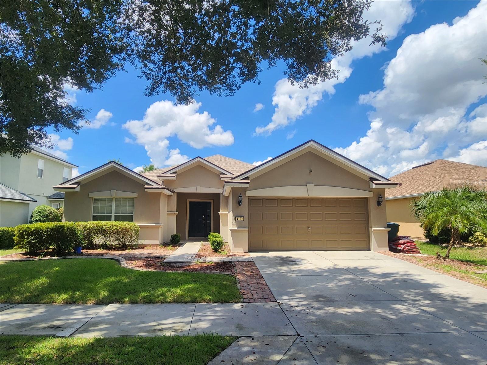 This home has room for everyone. Almost 1900 square feet of living space and designed for indoor and outdoor living. Oversized cascading sliding doors lead to a large screened patio, a pergola with an outdoor kitchen and a fenced back yard. New roof in 2024, solid surface countertops, and beautiful modern appliances. A portion of the 2 car garage has been renovated into a living space, yet a sperate space remains for all your garage storage needs. Low HOA still offers plenty of amenities, and the centralized location makes for easy access to the Highway 200 corridor and I-75.
