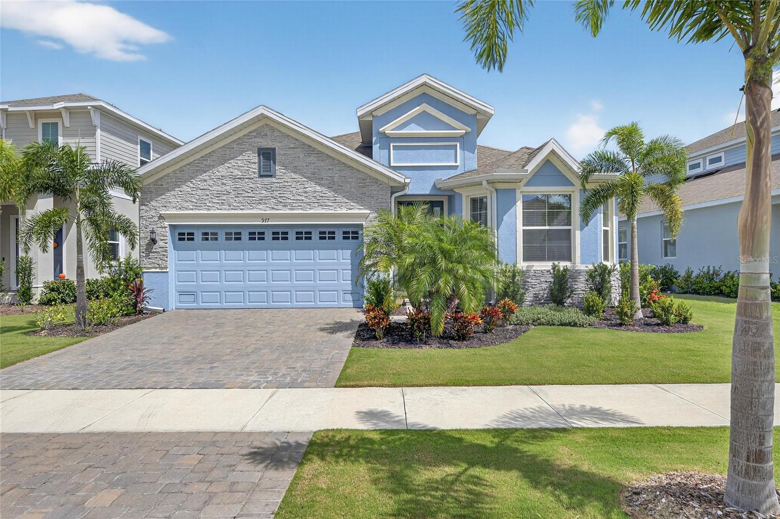 977 Signet | 4 Bedrooms | 3 Bathrooms | Office | 2,384 Sq Ft | Conservation Lot | Built 2023
This 2023 Park Square Homes Hampton floorplan is better than new, offering 4 bedrooms, 3 full bathrooms, and a private office with a charming bay window. With 2,384 square feet of living space, this home is filled with thoughtful upgrades and sits on a premium conservation lot, providing exceptional backyard privacy.
The open-concept design showcases a spacious family room, gourmet kitchen, and café area, all designed for both everyday living and entertaining. The kitchen is the heart of the home, featuring upgraded cabinetry, stainless steel appliances including a built-in oven and microwave, a cooktop, under-cabinet lighting, and an oversized quartz island that comfortably seats six. Throughout the home, you’ll find $31,000 in upgraded Shaw hardwood flooring, recessed lighting in every room, ceiling fans in nearly every space. Additional highlights include $11,250 in upgraded quartz in the kitchen and primary bath, a 12-foot sliding glass door that floods the home with natural light, and a $15,000 lot premium.
A true Split Floorplan with the 3 secondary bedrooms thoughtfully configured to provide privacy and comfort for any living situation.
The owner’s suite is a private retreat with a vaulted tray ceiling, dual sinks, a large walk-in shower, and generous closet space. Step outside to the large covered lanai, pre-plumbed for a summer kitchen, where you can relax and enjoy the peaceful views of the conservation area. With gutters already installed and every detail carefully considered, this home blends modern style with functionality, offering the perfect balance of comfort and design.
As a resident of MiraBay, you’ll enjoy one of Tampa Bay’s premier waterfront communities with resort-style amenities, including a lagoon-style pool, a secondary heated pool, clubhouse with café, 24-hour fitness center, tennis, pickleball, and basketball courts, walking trails, and direct access to Tampa Bay for boating and kayaking. MiraBay is also a golf cart friendly community, making it easy to enjoy the neighborhood and connect with friends and neighbors. This home offers not only modern living, but also a lifestyle centered around relaxation, recreation, and community.