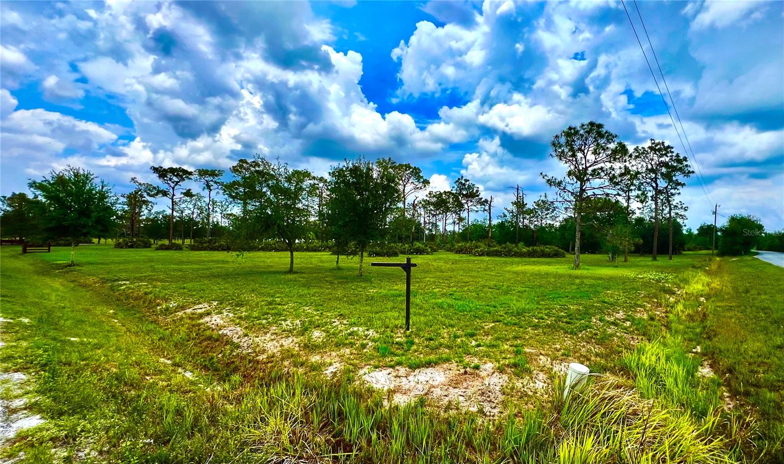 Rare opportunity to own 4.51 acres of high and dry land just outside Lakewood Ranch in Bradenton, FL. Tucked away for privacy from SR70, this beautiful parcel offers the perfect blend of rural tranquility and urban convenience. The property is fully cleared and ready for your dream home, estate, or agricultural use. A paved street ensures easy entry, while the expansive footprint offers ample space for horses, a custom build, workshop, or recreational vehicles. With no HOA or deed restrictions, this land is a blank canvas. Whether you’re looking to build a private retreat or hold as an investment while the surrounding area expands in one of Manatee County’s fastest-growing areas, this is must-see.