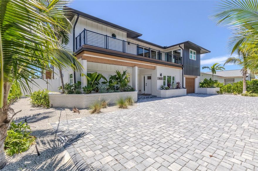 This newly renovated waterfront home on Anna Maria Island features nearly 80 feet of prime canal frontage, providing breathtaking views from almost every room of the property. A private boat dock and lift make this residence a paradise for boating enthusiasts, while also being only steps away from the beach. Step inside to discover a spacious open-concept living room with vaulted ceilings and two large balconies. A modern kitchen outfitted with high-end appliances, ample storage, and chic finishes overlooks your private pool and spa. The master bedroom features access to the back patio leading to the pool plus walk-in closet. The spa-like master bathroom centers around your stand-alone tub and frameless glass shower with dual his and her vanities. Recent renovations include electrical, plumbing, and air conditioning systems, impact-rated windows, new exterior siding, and a new metal roof, ensuring the home is both safe and energy-efficient. Schedule your showing today!