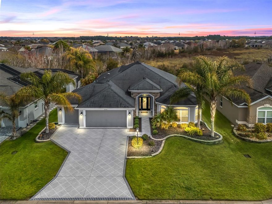 LUXURY HOME WITH VIEW OF PRESERVE! Experience refined Florida living in this beautifully appointed Laurel Oak 5 model offering 2,300+- sq ft of living space and 3,666 sq ft under roof, perfectly positioned with a tranquil view in the highly desirable Village of Osceola Hills.

From the moment you arrive, the curb appeal shines with stone accents, upgraded tropical landscaping beds, a painted driveway and walkway, and a leaded glass entry with sliding screen complemented by a Ring doorbell camera. The spacious 2-car plus golf cart garage adds both convenience and functionality.

Inside, the home showcases high ceilings throughout, gorgeous elongated ceramic tile and carpet flooring, plantation shutters, granite countertops, and elegant wood cornices in the great room. The open layout offers a spacious great room and dining room combination, ideal for entertaining and everyday living.

The kitchen is designed for both style and practicality, featuring a center island with dedicated wine storage, separate eating area, a large breakfast bar with gorgeous pendant lighting and custom paneling, beautiful granite counter tops, stone backsplash, a solar tube for natural light, a double pantry, and an appliance package including a wall oven and customized range hood.



The primary suite is a true retreat with high ceilings and a spa-like en suite featuring tower cabinetry, dual square sinks, walk-in shower with double showerheads, and a generous walk-in closet.

Guests will appreciate the private guest wing with two bedrooms—one featuring a tray ceiling and bay window—and a second full bathroom.



Enjoy Florida’s indoor-outdoor lifestyle through quadruple sliding glass doors plus a set of French doors leading to the screened lanai overlooking the peaceful Preserve—the perfect setting for relaxing or entertaining.



Additional highlights include an indoor laundry room with built-in desk, extra cabinetry, and utility sink.



Ideally located in one of The Villages’ most sought-after areas, this exceptional home combines luxury, comfort, and a prime location.