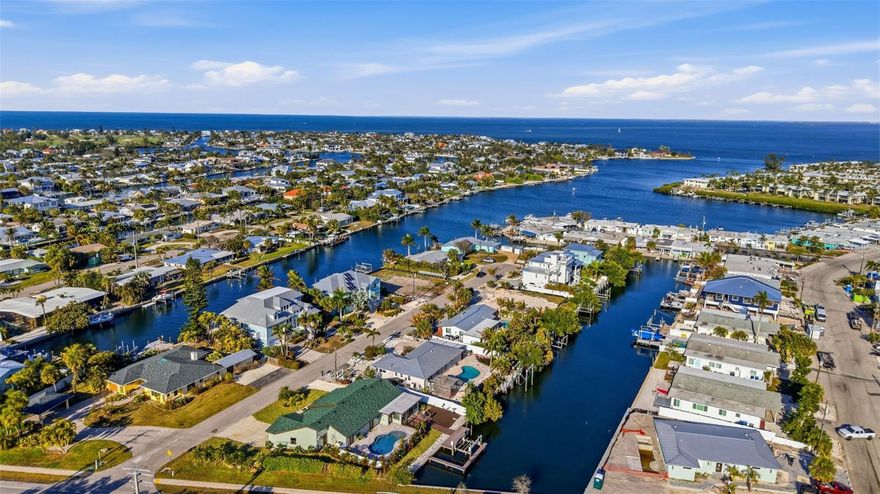Discover a rare opportunity in Holmes Beach: a fully renovated four-bedroom, three-bathroom waterfront home offering immediate access to the Intracoastal Waterway and the Gulf of America, along with direct beach access just steps away. Every element of this property is brand new, creating a true turnkey residence equally suited for personal enjoyment or investment.

Set on a deep-water canal with no bridges to open water, the home is designed for effortless boating. The composite dock and electric boat lift allow for quick departures to the Gulf, while the brand-new pool anchors a private outdoor setting ideal for entertaining or quiet relaxation. Whether returning from a day on the water or an afternoon at the beach 2 blocks away, the outdoor spaces are designed to complement the island lifestyle.

Inside, the renovation reflects a clean, modern coastal design with thoughtful functionality throughout. Four spacious bedrooms and three beautifully appointed bathrooms provide flexibility for hosting family and guests. Upgrades such as instant hot water at every faucet and an EV-ready charging connection add everyday convenience, while the garage offers valuable storage (an increasingly important feature on Anna Maria Island) plus potential for a future ADU conversion (buyer to verify zoning, permits, and feasibility).

Holmes Beach remains one of the most desirable enclaves on Anna Maria Island, known for its walkability, local dining, boutique shopping, and relaxed sophistication. With monthly rentals permitted, this home offers exceptional versatility as a primary residence, seasonal retreat, or income-producing property. Completely updated, impeccably located, and ready for immediate occupancy and with all furniture available for separate purchase, it represents island living at its finest.