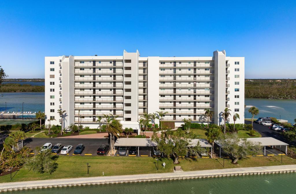 Now available at the lowest price per square foot with a full bay view on South Siesta Key! Behind the gates to the southernmost tip of Siesta Key lies The Pointe, a quiet community that, by it’s own words, supports and enriches it’s owners quality of life. This fourth-floor unit offers the largest footprint available with engaging amenities. Start your day with a gaze over glimmering waters as the sun rises or soak up warm Florida sunsets as day fades to dusk. A clean, bright space, this beautiful space will accept your most personal aesthetic. A large kitchen with white cabinets and stainless appliances is where you can craft your creative cuisine. Abundant windows provide views from every room while allowing cheerful Florida sunshine to fill the generous, open concept living and dining room. Your primary suite is spacious with en-suite bath and access to the adjacent screened lanai. A second bedroom will comfortably accommodate your family or guests with a second bath that will nicely suit their needs. The lanai serves as a perch to drink in the view while considering your upcoming day or relaxing and counting your blessings after sunny Siesta Key adventures. An oversized laundry room is beyond convenient, as well as the premier parking spot for this unit just steps from the front of the building. Situated on over 5 acres of premier and gated Siesta Key property, find yourself immersed in an elevated lifestyle featuring exceptional amenities including a heated lap pool & spa, clubhouse, tennis & pickleball courts, fitness center, BBQ grills, boat docks and kayak storage, as well as onsite management. Every Siesta Key day offers local adventures including Turtle Beach, Crescent Beach, the lively Siesta Key public beach & park, the vibrant Siesta Key village, along with a plethora of shops and eateries. Venture a bit further and experience the lively cultural scene of downtown Sarasota, any number of barrier islands and their beaches, historical Venice, or one of the many gorgeous golf courses in and around the area. The quintessential Florida lifestyle can be yours here at The Pointe!