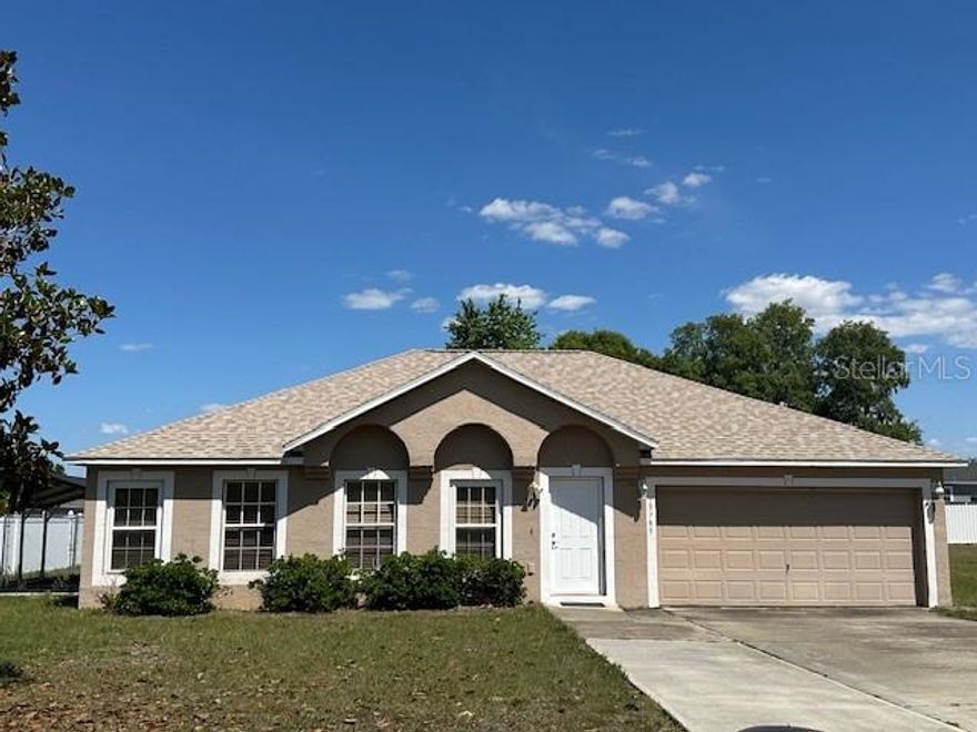Location! Ready to move in.  Roof replaced in 2025 and partial driveway rebuilt. This home features four bedrooms, two bathrooms, living room, huge great room, dining room, two pantries, center island with a mini sink, stand-up shower, garden tub, tub/shower, linen closet, another closet by the dining area, an enclosed patio with sliding windows, fenced-in backyard, carport, and a shed. Home is located minutes from CR484, I-75, food shopping, schools, the library, the community center, and much more. More pictures to follow.