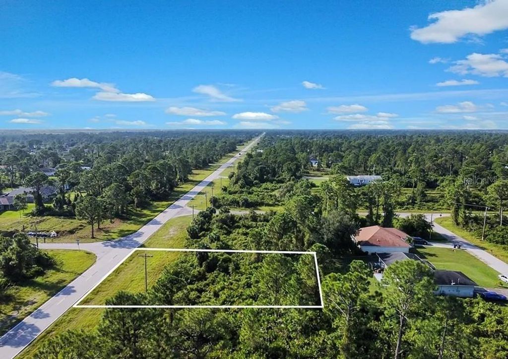 Photo of 730 Columbus Boulevard S, Lehigh Acres, FL 33974 (MLS # C7526532)