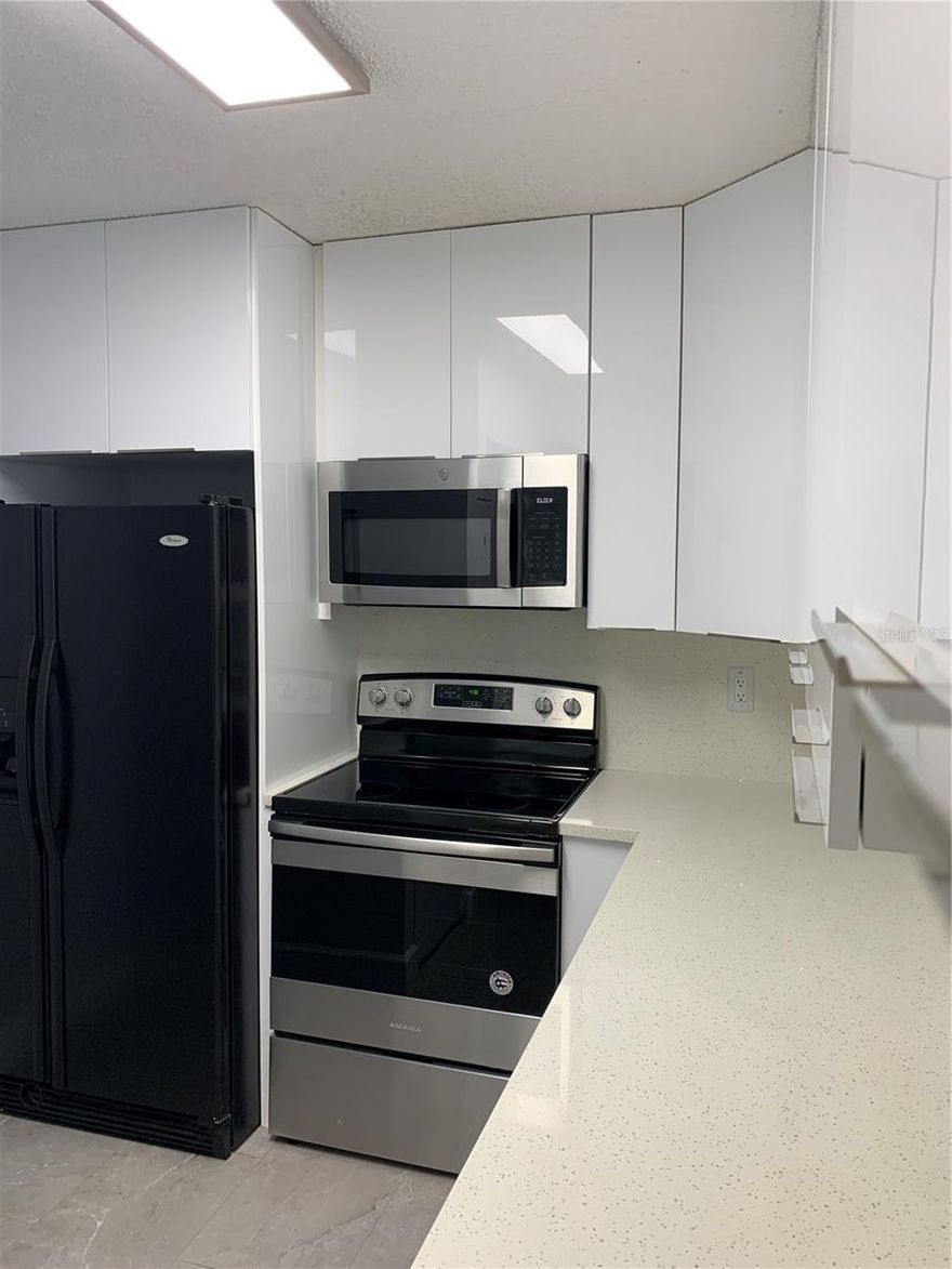 Super-cute first-floor corner unit condo just minutes from Walt Disney World, I-4, and SR-429! Welcome to the tucked-away and welcoming community of Palm Villas, where this well-located unit offers a fantastic view and an incredible opportunity—whether you’re looking for a primary residence or a short-term rental/Airbnb investment.

This spacious 3-bedroom, 2-bath condo features an updated HVAC system and beautiful wood flooring, found throughout all living areas. The open living and dining spaces flow seamlessly to a screened back patio with no rear neighbors, creating a private and relaxing setting.

The galley-style kitchen offers ample cabinet storage and workspace, while the primary suite, located just off the main living area, includes direct patio access and peaceful backyard views. The primary bathroom features a full tub/shower and a convenient owner’s closet.

Two additional bedrooms are located near the second full bath, including an oversized 11 x 19 bedroom with its own owner’s closet. Both bathrooms and the kitchen include upgraded laminate flooring with stylish grout accents.

Residents enjoy access to a community pool and tennis courts, and each unit includes an assigned parking space with additional guest parking available.