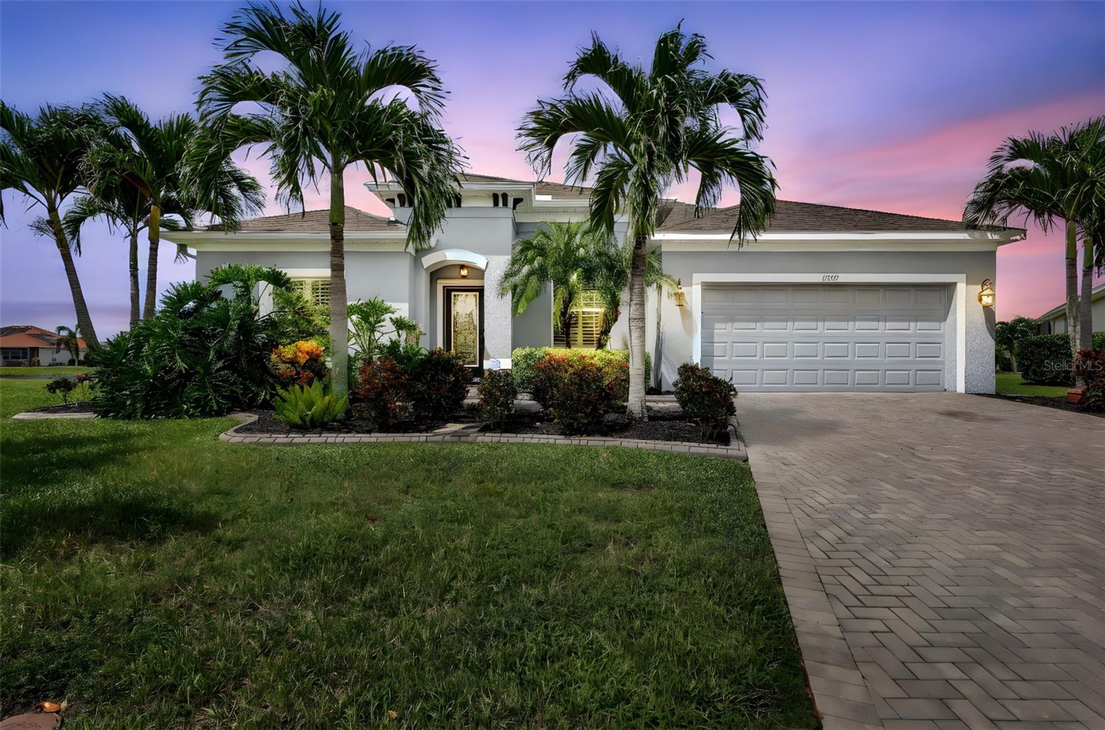 Delightful setting in the amazing community of Greyhawk Landing West. Freshly painted inside and outside, with ceramic tile throughout the whole house. This four-bedroom, three and a half bath home is designed for gathering with friends and family, but has equally private rooms for more peaceful moments. A gated community with fabulous amenities and walking paths. Set on a quiet cul-de-sac lot. Entering this lovely home thru a decorative glass front door, you have double window French doors flex front room. The shared full-bathroom across the hall with two bedrooms. Additional guest half-bath in the hall. The centerpiece kitchen has a long "T" granite single counter breakfast bar with sink, gas stove and several cabinets. Wired for surround sound and shiplap walling. Looking out through the three-panel slider, into the open floor plan forward onto the lanai, pool, spa and pond view. Just off the kitchen a great dining space for long table dining. The master suite to the rear left of the home, with tray ceiling and sliders for slipping out to the pool. Master bathroom with double sinks, garden style tub and walk-in shower. The other half of the home holds the fourth bedroom with walk-in closet, full-bath shared into an additional flex room with built-in desk and shelving creating an ensuite or additional office. The utility room is larger with wall shelving. Two-car garage with a larger closed storage room and full house water softener. Paver driveway. The lanai has a covered area for shade for dining or laying back. Pool and hot tub all with view of a wonderful pond behind. The lot is premium with large distances from the neighbors. Greyhawk Landing has treasured landscaping, resort-style amenities including two larger pools, splash park, tennis, basketball court, fitness room and biking trails. Close to grocery, shopping and restaurants. LOW HOA! Community is centered between St. Pete to the North, Sarasota to the South, next to Lakewood Ranch and Anna Maria Island your direct Gulf Coast beaches. A must see, but don't think this will last long. See you soon:)