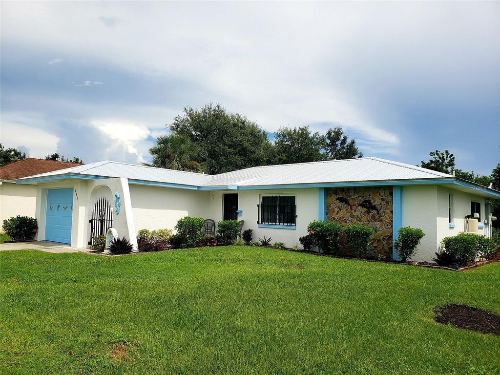 Photo of 953 Tropical Avenue NW, Port Charlotte, FL 33948 (MLS # C7514830)