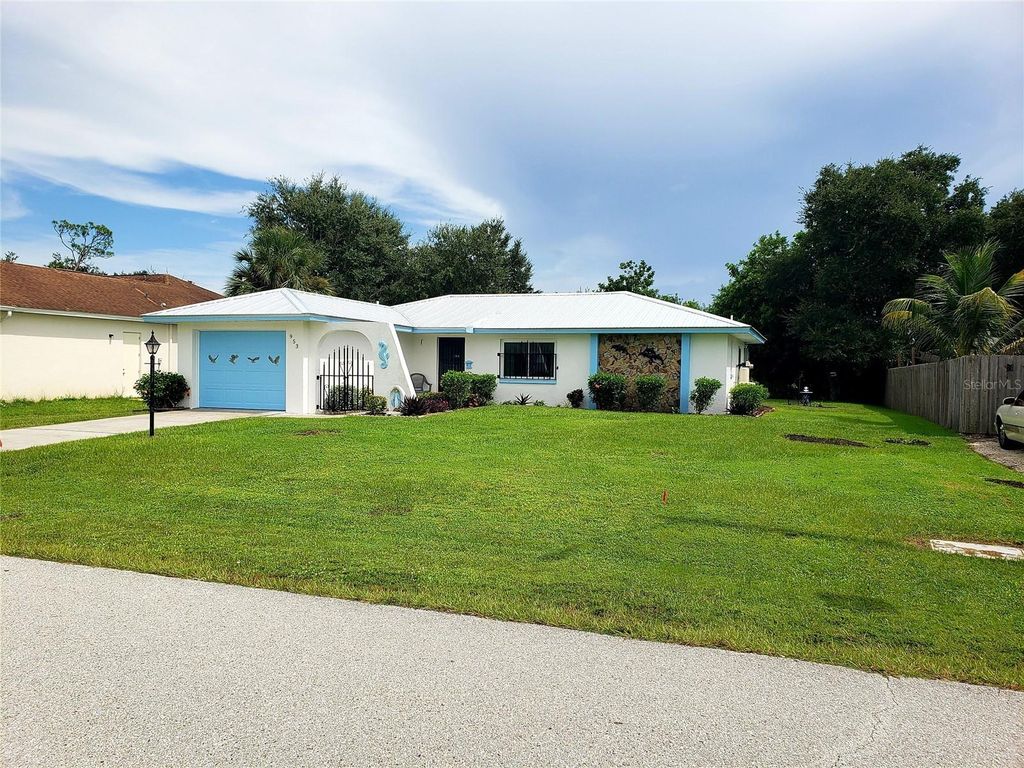 Photo of 953 Tropical Avenue NW, Port Charlotte, FL 33948 (MLS # C7514830)