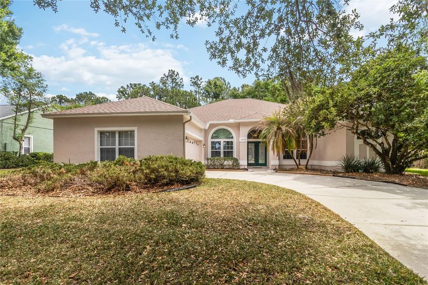 Immediately available in University Estates, this 3-bedroom plus den/office/flex room a 3-full-bath home with a side-loaded 2-car garage is set on a private wooded lot at the rear of the property. The home features a long driveway and has been thoughtfully updated with a new roof in 2024, hvac 2021 and replumb in 2026.
 
Upon arrival, you are welcomed into a front foyer that flows seamlessly into the formal dining and living areas, along with an adjacent private office or flex space. Sliding glass doors lead to an oversized screened porch that overlooks the peaceful wooded backdrop, creating a perfect setting for relaxing or entertaining.

The kitchen is generously sized and open to the family room, offering granite countertops, stainless steel appliances, and ample cabinet space. An interior laundry room adds convenience to the layout. The home features a split-bedroom floor plan for added privacy. The primary suite is spacious and includes two closets and an oversized bathroom with dual sinks, a soaking tub, and a separate shower.

One secondary bedroom is located near a guest hall bath, while the third bedroom includes its own en-suite bath—ideal for guests or multigenerational living.

University Estates offers a range of community amenities, including a pool, playground, tennis courts, and basketball courts. Conveniently located just minutes from shopping, dining, and entertainment, with easy access to major employers and institutions such as the University of Central Florida and Siemens, making this an ideal location for both comfort and convenience.