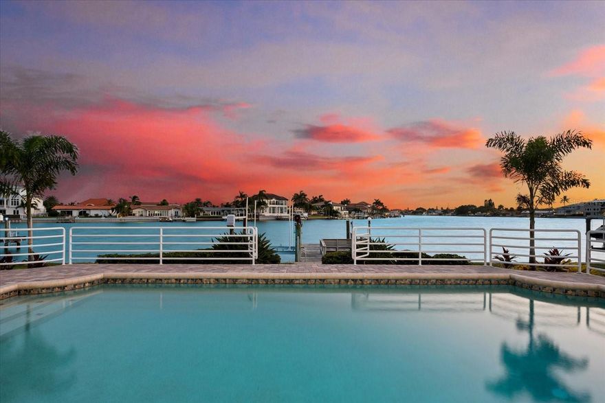 This is the home you have been waiting for in Belleair Beach with 100 FT OF SOUTHERN EXPOSURE WATERFRONT, which allows you to relax, enjoy fresh Gulf breezes, and witness awe-inspiring sunrises and sunsets over the horizon. Upon arrival you will appreciate the newly added pavered circular drive and landscaping installed earlier this year, a must for all the visitors you will have. The residence has been thoughtfully styled and redesigned for today's open-concept style of living. The renovated gourmet kitchen boasts Cafe appliances, a gas range with a pot filler, and two sinks allowing for easy meal preparation. While in the kitchen you can gaze out at the oversized living and dining room combination, with water glistening just beyond. Indulge in the meticulously renovated primary suite, where every morning you can wake up to water views right from the comfort of your bed. However, the extravagance doesn't stop there - step into the redesigned spa-inspired bathroom and immerse yourself in views of the water while you unwind in your luxurious soaking tub. The additional bedrooms offer guests complete privacy, with renovated ensuite and adjacent bathrooms, as well as their own access to the pool and Intracoastal. Call today for your private tour of this RENOVATED residence in the HIGHLY SOUGHT AFTER boaters and beach lovers’ paradise.