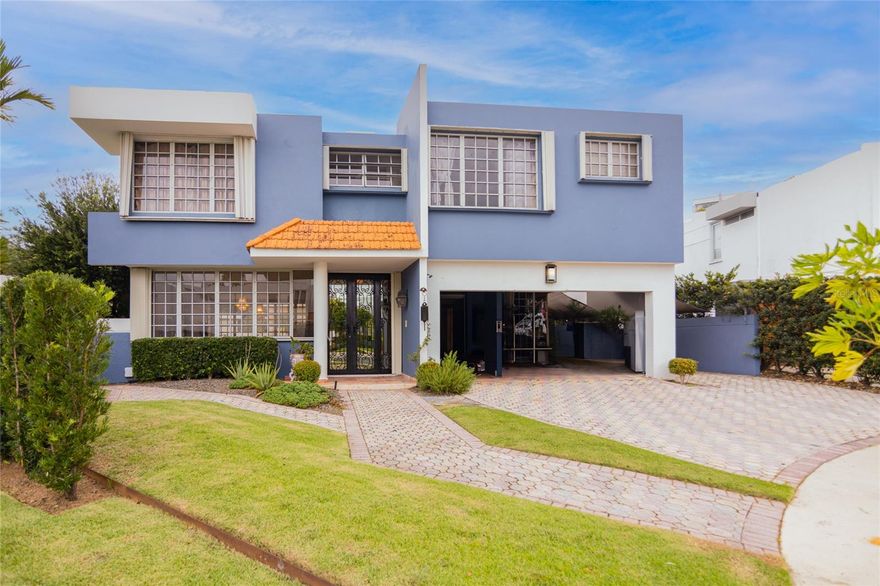 Welcome to this beautifully appointed 4-bedroom, 3-full-bath residence offering approximately 3,216 sq ft of comfortable living space, situated on a generous 696 m² lot at the end of a quiet cul-de-sac in one of San Juan’s most coveted gated communities.
The main level features a grand living and formal dining area, a spacious family room, and a well-appointed kitchen with custom wood cabinetry and granite countertops. The covered terrace flows seamlessly to the pool area and includes a wet bar — perfect for entertaining — complete with a billiard table. Adjacent to the pool, a versatile cabana/flex room offers endless possibilities: home office, guest suite, or private gym.
Upstairs, the oversized primary suite is a true retreat, featuring a walk-in closet, an additional closet, and a spa-inspired bathroom with his-and-hers sinks, a jetted soaking tub, and a separate shower. Adjoining the primary suite is a generously sized enclosed bonus room — a private, versatile space perfect as a sitting room, home office, creative studio, or personal lounge. The laundry room is conveniently located on the second floor.
The property offers parking for up to 6 vehicles — an open 2-car carport plus a driveway with space for 4 additional cars. A full-house power generator is included (specs to be confirmed).
Los Paseos is a gated community with 24-hour security and controlled access, offering residents a clubhouse, fitness center, community pool, tennis courts, pickleball courts, basketball court, jogging track, gazebo, playground, and beautifully maintained green spaces — all within one of San Juan’s most established and family-oriented communities. Steps from Galería Paseos for everyday conveniences, with direct access to PR-18 and PR-52 putting all of San Juan within easy reach. Motivated seller.