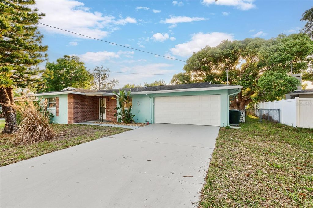 Photo of 1248 Lazy Lake Road W, Dunedin, FL 34698 (MLS # TB8493847)