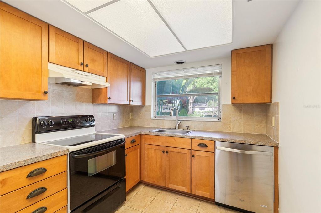 Photo of 1248 Lazy Lake Road W, Dunedin, FL 34698 (MLS # TB8493847)