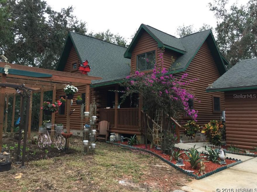 TRUE log cabin, one of a kind, must see showplace.  Quality construction throughout.  Loft could be third bedroom.   Two master suites; one on each floor.  Just under an acre between US 1 and river on paved road.  Beautiful canopy of trees.   24 X 30 freestanding garage with A/C and 220 electric.  Double insulated thermopane windows.  A real treat to view.  Virtual tour coming soon. ;Water: City