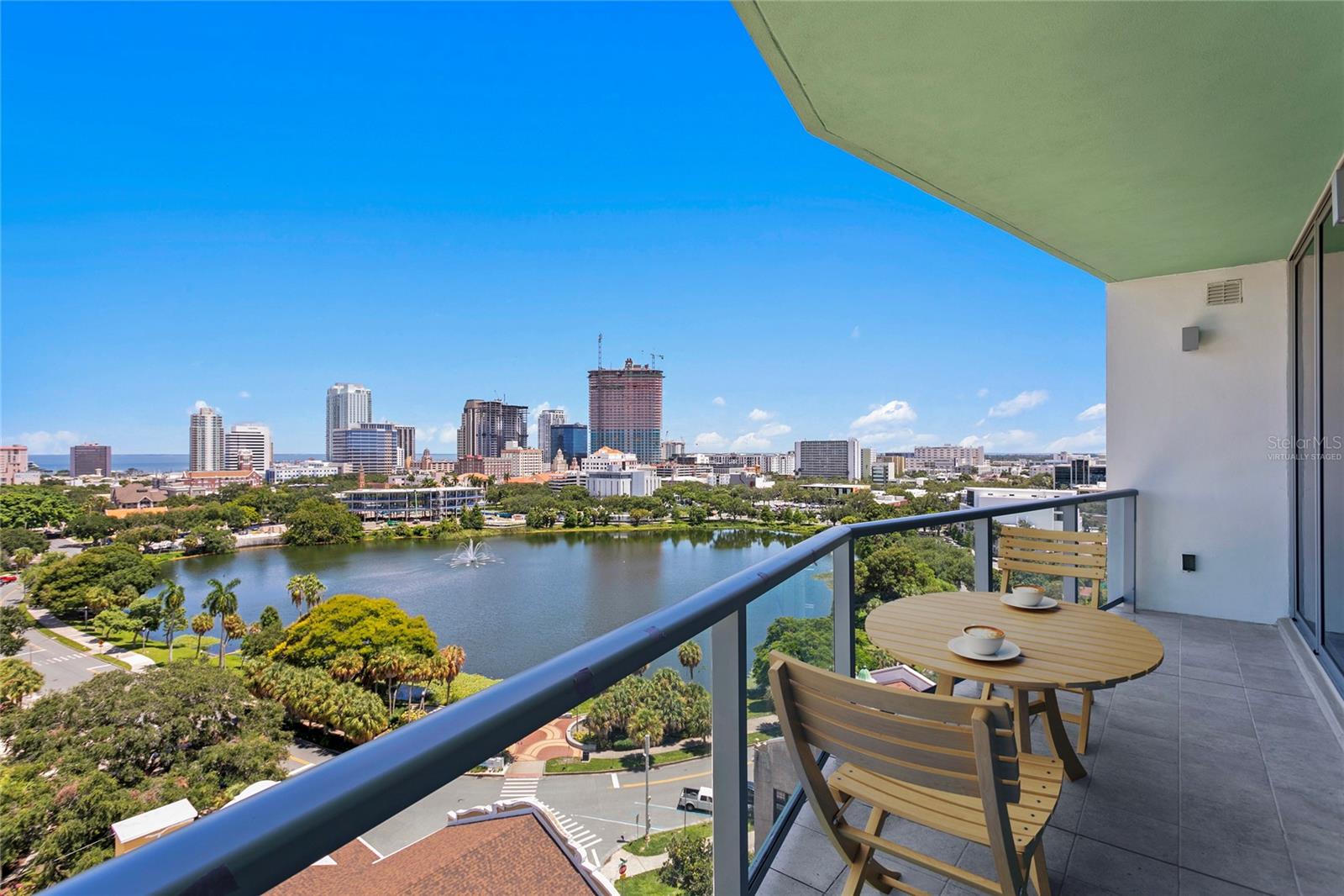 One or more photo(s) has been virtually staged. Discover your next extraordinary chapter at REFLECTION St. Pete. Be the first to embrace the pinnacle of urban luxury living in this exclusive offering with unparalleled views from its prime 12th-floor vantage point. Gaze eastward over Mirror Lake, where the St. Petersburg skyline meets the shimmering waters of Tampa Bay. Spanning over 1700 square feet, the Jade floor plan epitomizes sophistication with its spacious split layout. Entertain effortlessly in the expansive great room, adorned with floor-to-ceiling windows and sliding glass doors that invite the stunning vistas into every corner. Step out onto the expansive glass balconies to savor panoramic views that stretch across the vibrant heart of St. Petersburg. Indulge in a culinary journey with gourmet stainless steel appliances and sleek quartz countertops. Luxuriate in the elegance of porcelain flooring throughout the main living areas, while the European-inspired wet room bathrooms feature upgraded fixtures and refined finishes. Retreat to the master bedroom with its own terrace access, perfectly complementing the residence’s elevated lifestyle. Residents of REFLECTION enjoy exclusive access to a 12,000 square foot rooftop oasis, featuring an air-conditioned fitness center and social club, a serene tropical pool and spa terrace, and an outdoor kitchen and wet bar. Each amenity is designed to offer both relaxation and inspiration, framed by sweeping views of Mirror Lake, Downtown St. Petersburg, and Tampa Bay. Ideally situated at the intersection of Downtown St. Petersburg, the Edge District, and the Warehouse Art District, REFLECTION embodies the essence of urban vitality and cultural richness. Here, every detail is meticulously crafted to enhance your lifestyle, ensuring both comfort and convenience. Your safety is paramount at REFLECTION, with state-of-the-art electronic air filtration systems, MERV13 filters, and touchless amenities throughout the building. Experience a new standard of luxury living, where every aspect is designed to elevate your experience and exceed your expectations. Renter’s insurance required by landlord.