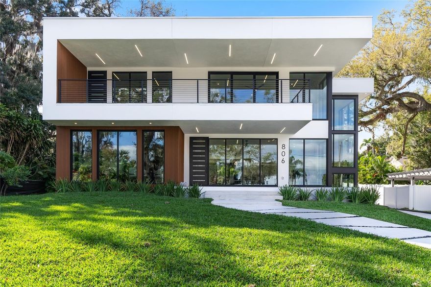 Brand-New Modern Home with Stunning Lake Concord Views!  Welcome to this architecturally stunning, newly built home in the heart of desirable College Park. Designed with solid concrete walls and steel beam construction, this home offers both durability and sophistication, along with breathtaking views of Lake Concord.  Step inside and you’ll find a spacious, open-concept layout that’s perfect for both everyday living and entertaining. With four bedrooms, three full baths, and three half baths, this home provides plenty of room for family and guests. There are two primary suites, one conveniently located on the first floor and another on the second, offering flexibility and privacy. The secondary bedrooms are bright and inviting, with plenty of natural light.  If you love to cook or entertain, you’ll appreciate the large, beautifully designed kitchen. And for those special occasions, the fully equipped butler’s/caterer’s kitchen—complete with additional washer and dryer hookups make hosting effortless. There is also a full laundry room upstairs for added convenience.  The basement is an entertainer’s dream, featuring a spacious game room with a wet bar and a separate theater room with its own storage closet. Whether you’re hosting a movie night or game day, this space is ready for fun.  Step outside, and you’ll fall in love with the saltwater pool, complete with a sun shelf and an unmatched view of the lake. The linear propane fire pit adds warmth and ambiance, making it the perfect place to unwind. The back patio is designed for relaxation, with marble flooring and an outdoor shower, while the second-floor balcony offers even more space to enjoy the scenery. The front patio and beautiful landscaping complete the picture, making this home as stunning on the outside as it is inside.  Location? It doesn’t get better than this! You’re just minutes from I-4, Orlando International Airport, Orlando Executive, and Sanford International Airport. Plus, you have easy access to Florida’s East and West Coast beaches, world-class theme parks, the Dr. Phillips Performing Arts Center, Amway Center, zoos, shopping, dining, and so much more.  This home is truly a rare find, perfect for entertaining, relaxing, and enjoying the best of Orlando living.  Call today to schedule your private showing!