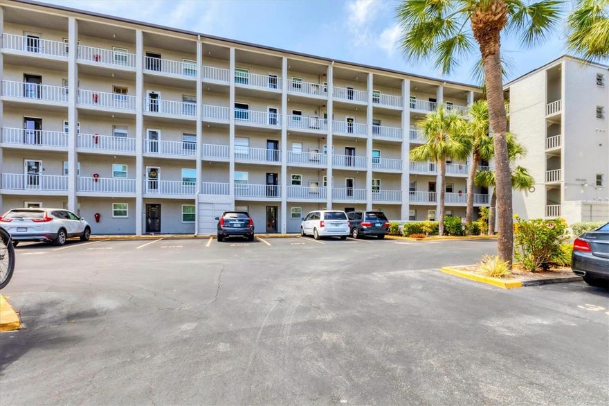 Welcome to easy living in this beautifully updated 2-bedroom, 2-bath condo in a 55+ community in central Bradenton! This 4th-floor unit offers stunning lake views from the spacious enclosed lanai, accessible from both the great room and the primary bedroom. Inside, you'll find an updated kitchen with newer cabinets, countertops, and appliances, plus easy-care laminate flooring throughout. Enjoy peace of mind with impact windows and a 2022 A/C unit. The primary suite features a walk-in closet and a gorgeously remodeled bathroom with a modern vanity, sleek sliding shower doors, and a convenient shower niche. The second bedroom is perfect for guests and is served by a nearby hall bath with updated finishes. The in-unit washer and dryer add everyday convenience. Community amenities include a pool, clubhouse, shuffleboard, and a tranquil dock on the lake perfect for enjoying the Florida lifestyle. With low fees and a central location close to shopping, dining, and medical facilities, this is the ideal place to call home for year long residents and snowbirds.