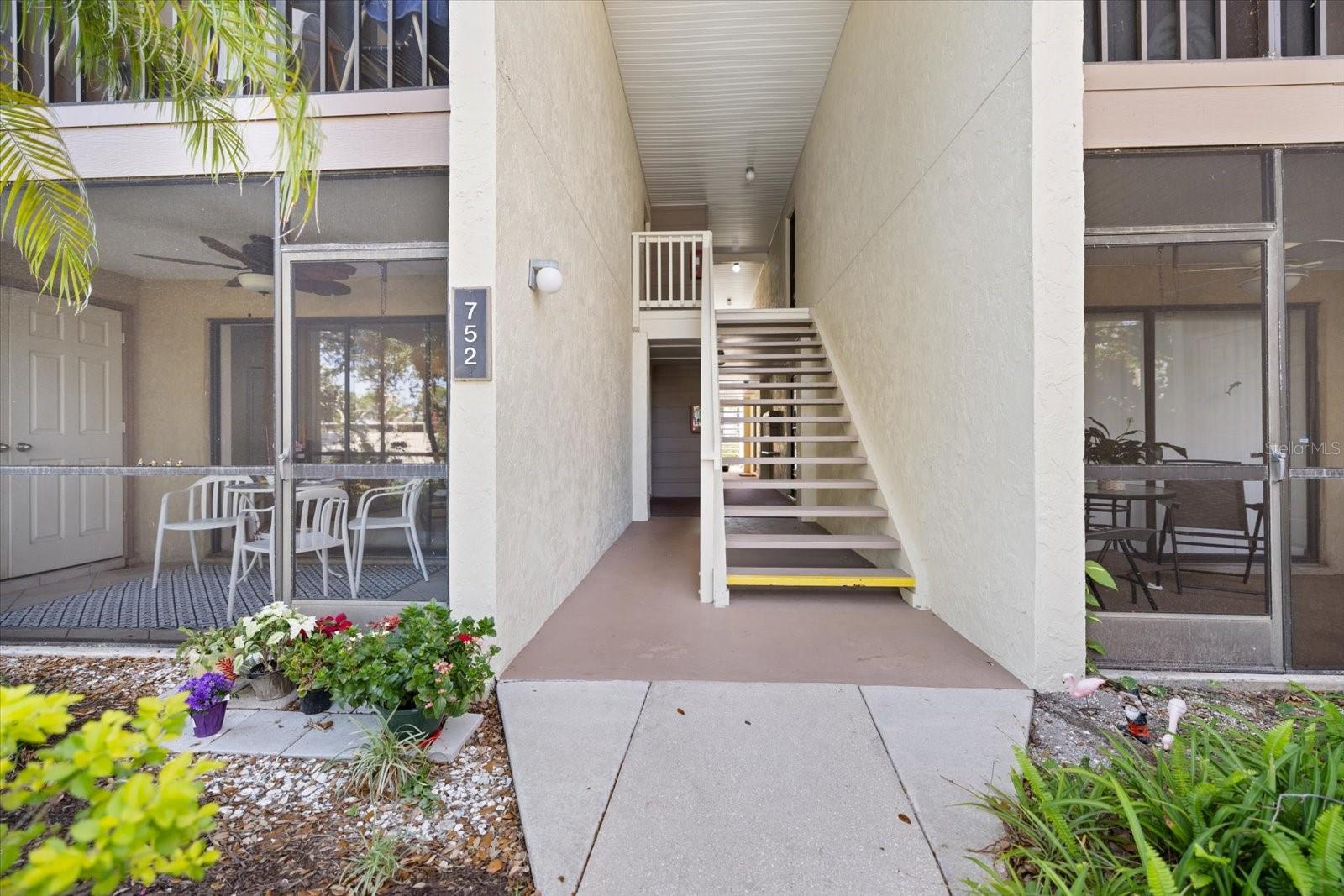 Welcome to your piece of paradise! GROUND FLOOR. END UNIT. WATER VIEW. TURNKEY FURNISHED. Step inside and fall in love with the updated furniture, fresh paint, new flooring, and your forever pond view. This unit also features a versatile flex space — currently used as a home office but easily adapted to fit your needs. Both bedrooms are spacious and include walk-in closets for plenty of storage. Located in the highly desirable Bird Bay Village, this community is rich in amenities: a heated pool, tennis courts, pickleball courts, fitness center, shuffleboard, and a vibrant clubhouse. The HOA covers water, sewer, trash, basic cable, pest control, exterior insurance, and grounds maintenance — giving you true peace of mind and a stress-free lifestyle. Bird Bay Village buzzes with year-round activities, social events, and clubs, creating a warm and welcoming atmosphere. Ideally situated close to world-class beaches, shopping, dining, and the scenic Legacy Trail, this condo is perfect for outdoor enthusiasts and anyone who appreciates Florida’s natural beauty. Whether you’re searching for a seasonal escape, a full-time home, or a smart investment, this condo checks every box. Don’t miss your chance to embrace the ultimate Florida lifestyle — Paradise Awaits!