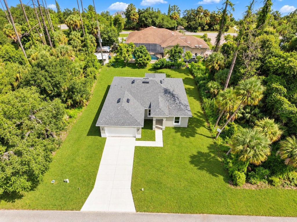Photo of 17104 Doyle Ave, Port Charlotte, FL 33954 (MLS # O6441154)