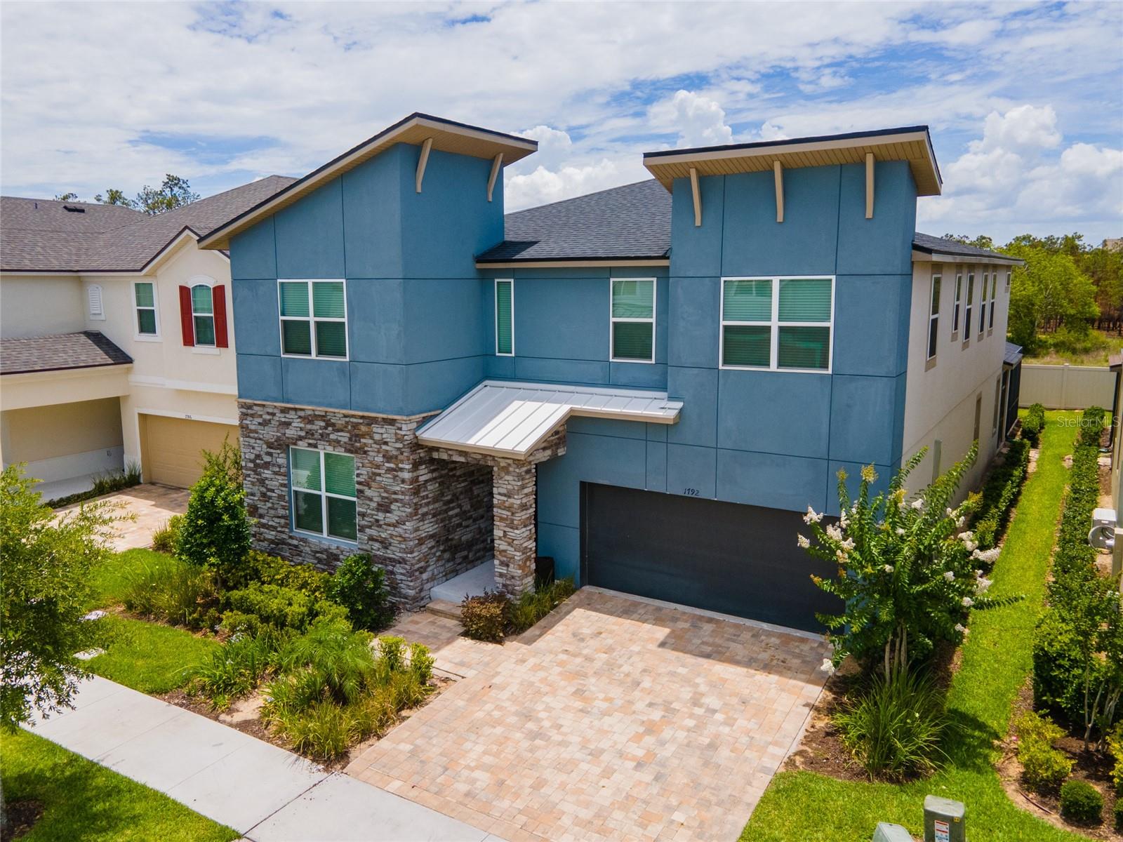 Don’t miss your chance to own this stunning 9-bedroom, 6.5-bathroom pool home in the highly desirable Solara Resort - just 15 minutes from Walt Disney World and 30 minutes from Universal Studios Orlando, with world-class shopping, dining, and entertainment close by. This spacious home is priced to sell and ready to move in. It’s professionally designed with a bright, open layout, a modern kitchen featuring stainless steel appliances, plenty of seating, and a cozy living area that opens up to a screened-in private pool and spa. With no neighbors behind the house, you can enjoy extra privacy and a peaceful setting. Fun takes center stage with a custom Jurassic Park-themed game room that includes arcade machines, foosball, and air hockey. Upstairs, there’s a cozy movie theater loft with comfortable seating - perfect for movie nights or hosting friends. With multiple themed bedrooms and luxurious king suites, this home comfortably sleeps 20+ guests, making it ideal as a vacation home, short-term rental investment, or full-time residence. Homes like this are rare - ready to move in, full of upgrades, and located in one of Central Florida’s best resort communities.
