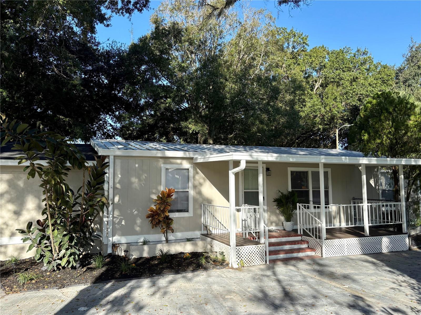 Beautifully Remodeled 3 Bedroom, 2 Bathroom Double-Wide Home on Corner Lot
Welcome to this stunning and move-in-ready double-wide manufactured home situated on a spacious quarter-acre corner lot in a quiet, family-friendly neighborhood. Featuring 3 bedrooms, 2 bathrooms, and modern upgrades throughout, this home perfectly blends comfort, style, and functionality.
Inside, you’ll find vaulted ceilings and an open floor plan that fills the space with natural light. The remodeled kitchen and living areas offer a modern design ideal for entertaining and everyday living. The primary suite features a large walk-in closet and a private bath, while the additional bedrooms provide ample space for family or guests.
A bonus storage room off the enclosed garage adds versatility for a workshop, hobby area, or extra storage. The spacious laundry room offers convenience and practicality. Outside, enjoy a relaxing front porch shaded by mature trees, a partially fenced yard, and a large driveway that extends all the way to the garage—providing plenty of parking space.
Additional features include a durable metal roof for long-term peace of mind and low maintenance. The property is ideally located near shopping centers, restaurants, and local amenities, offering both privacy and convenience.
This beautifully updated home is modern, family-friendly, and completely move-in ready—a perfect combination of charm, comfort, and value. Don’t miss the opportunity to make it yours!