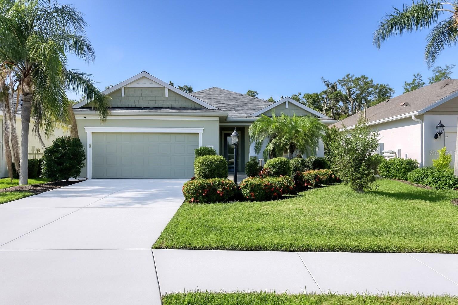 One or more photo(s) has been virtually staged. 4806 Lake Breeze Terrace, a beautifully maintained 4-bedroom, 3-bath home located in the highly sought-after gated community of Woodbrook. This neighborhood has NO CDD, low HOA fees, community pool, clubhouse and playground. This Neal-built residence offers a spacious and thoughtfully designed floor plan, showcasing quality craftsmanship. The heart of the home is the open-concept kitchen, dining and living area, ideal for entertaining, with granite countertops, solid wood cabinetry, and an impressively large walk-through pantry/laundry complete with built-in shelving, that is a must see. The generous living spaces continue with a sizable primary suite featuring private lanai access, two large walk-in closets and a en-suite bath. Three additional bedrooms provide flexibility for guests, home office, or hobbies. Additional interior features include plantation shutters on every window, central vac system, ceiling fans, a whole-house Kohler generator (2020), New Roof (2024), New Flooring throughout (2025) and freshly painted inside (2025). Enjoy Florida living year-round on the expansive screened lanai, already equipped with gas and water lines, perfect for designing your dream outdoor kitchen. The community pool is steps away from your back lanai. Ideal location, close to golf, restaurants, shopping, beaches and more.