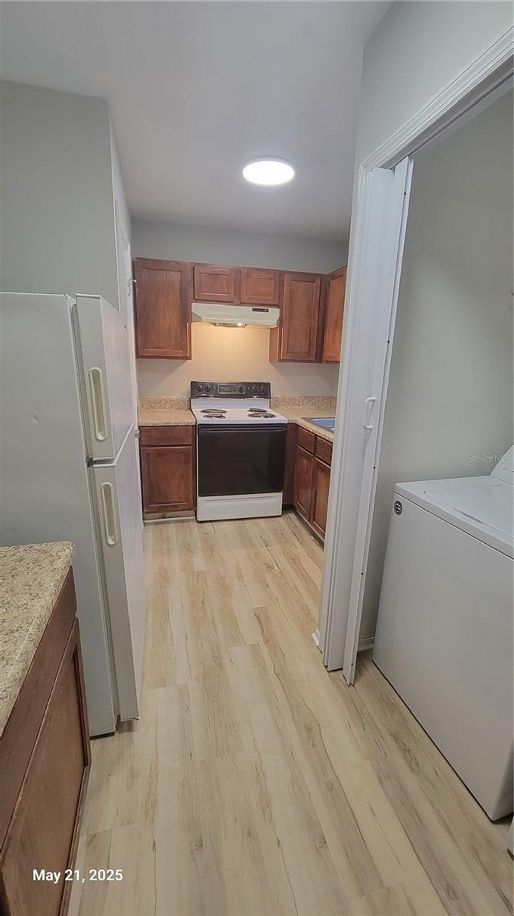 Photo of 4136 Pershing Pointe Place #5, Orlando, FL 32822 (MLS # O6349948)