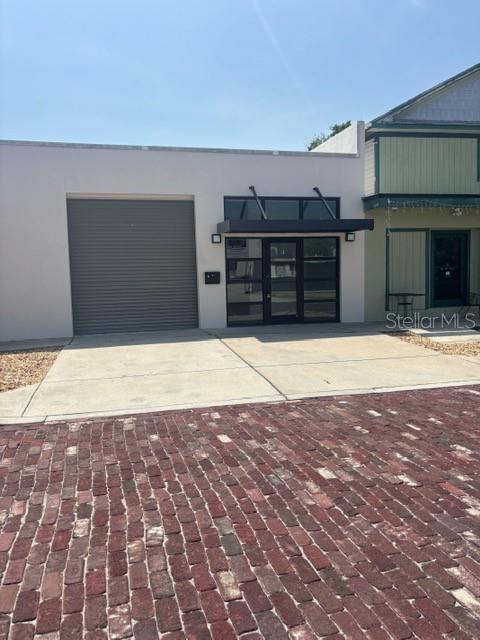 Awesome office, or wearhouse space. Right in the heart of downtown Tarpon Springs!!! Would make a great rental space for Golf Carts, Bikes, Beach Items ect. Has a rolling garage door right in the front. Beautiful new bathroom. Open floor plan with back office area.