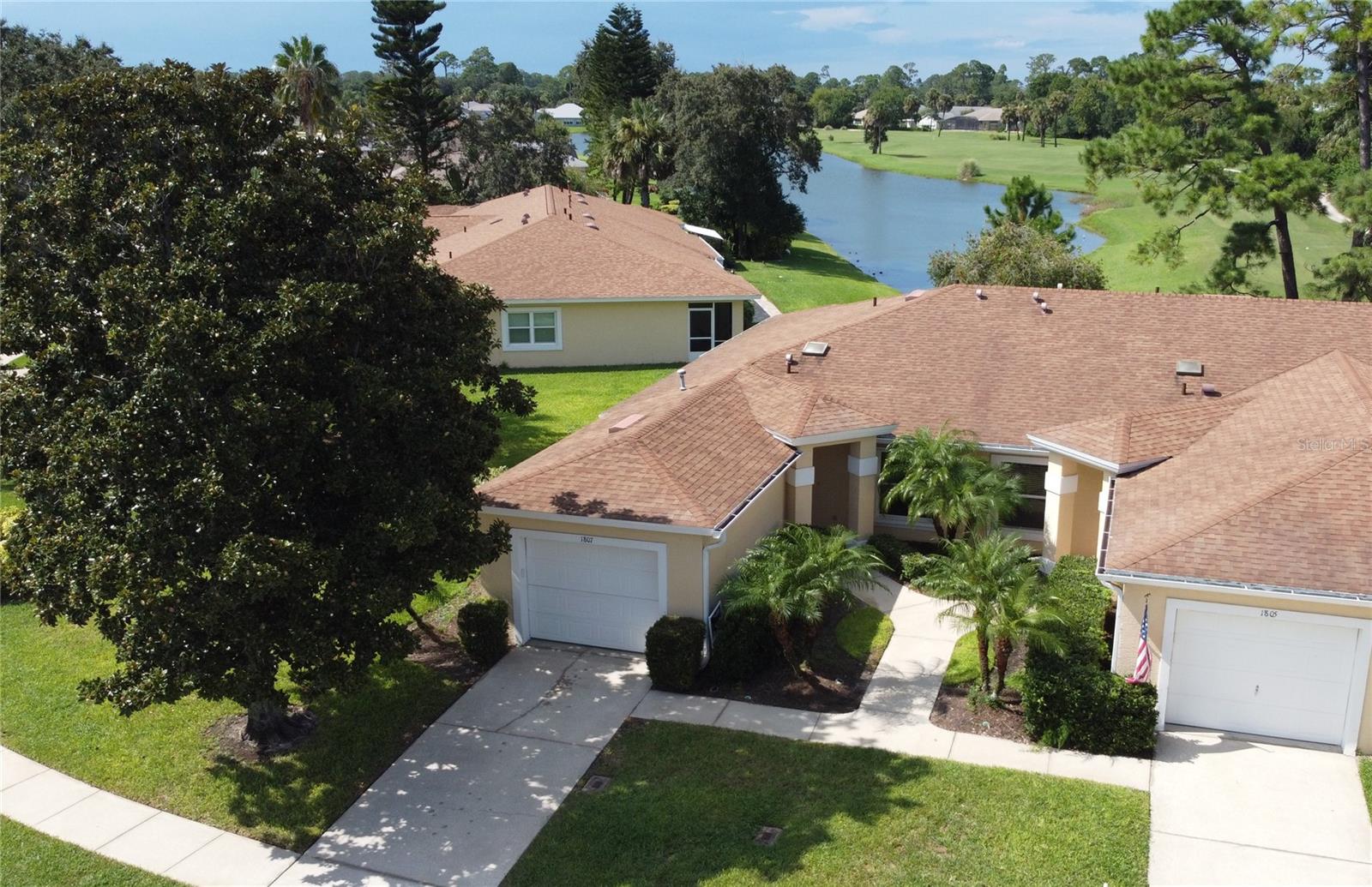 A Villa with an amazing view. This two bedroom, two bath Golf Villa located on the 11th tee box of The Preserve at Turnbull Bay Golf Club is a bright, cozy, lakefront end unit offering an abundance of natural light with spectacular views of the golf course and water! Watch the waterfowl which includes ducks, Herons, Wood Stork, Spoon-Billed Roseate, Sand Hill Cranes, Osprey, and a nesting pair of Bald Eagles while relaxing in your screened in lanai with morning coffee sunrise or a glass of wine with sunset. The primary bedroom has a large walk-in closet and bath, the second bedroom features a large space with built in closet. The open floor plan features a comfortable kitchen overlooking the dining and living areas. All exterior maintenance is covered by the association. Community is pet and golf cart friendly. Off the beaten path, yet only minutes to shopping, world-class dining, and one of the most beautiful drive on beaches in Florida, your New Smyrna Beach home awaits!