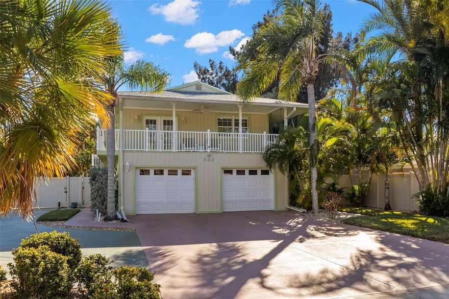 TROPICAL PARADISE in highly sought after coastal community of Crystal Beach! Don't miss this inviting Key West style home with pool, hot tub, tiki hut and outdoor kitchen. This beautifully maintained home has a newer roof (2020), newer AC (12/23), 2 large bedrooms and 2 bathrooms on the main level upstairs. The eat in kitchen has beautiful granite counter tops, solid wood cabinets and overlooks the great room and family room with a wood burning fireplace. A nice open space to entertain! The primary bedroom is large and opens up through french doors to the wrap around porch- a perfect place to enjoy your morning coffee or to view evening sunsets. The second bedroom is also a good size. The bathroom that could be associated with the primary bedroom has a spacious jacuzzi tub. New luxury vinyl flooring and carpet in the bedrooms. THE BONUS AREA downstairs has lots of possibilities. It could be a 3rd or 4th bedroom and there is a full bathroom. Great in law suite. And also downstairs is a large workshop space and utility room. Relax in the downstairs enclosed porch overlooking the private, tropical backyard with swimming pool with waterfall, hot tub, tiki hut, outdoor kitchen, outdoor shower, lush resort style landscaping and bamboo fencing- perfect to entertain in the Florida lifestyle! Have a boat or RV? No problem! Plenty of parking space. Crystal Beach is golf cart friendly so ride over to the park and brand new pier to watch breathtaking nightly sunsets. Youth Center, and the close by 54 mile Pinellas Trail. Crystal Beach is a lifestyle with events such as a golf cart parade, chili cook off, concerts in the park. Tucked away, but close to Dunedin and Tarpon Springs, world famous Clearwater Beach, Innisbrook Resort and Golf Course, 2 international airports, shopping, restaurants, Pop Stansell Park, hospitals, A rated schools. No HOA. Enjoy your piece of paradise in this special coastal town!