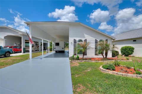 Photo of 1083 Motorcoach Drive, Polk City, FL 33868 (MLS # L4960975)