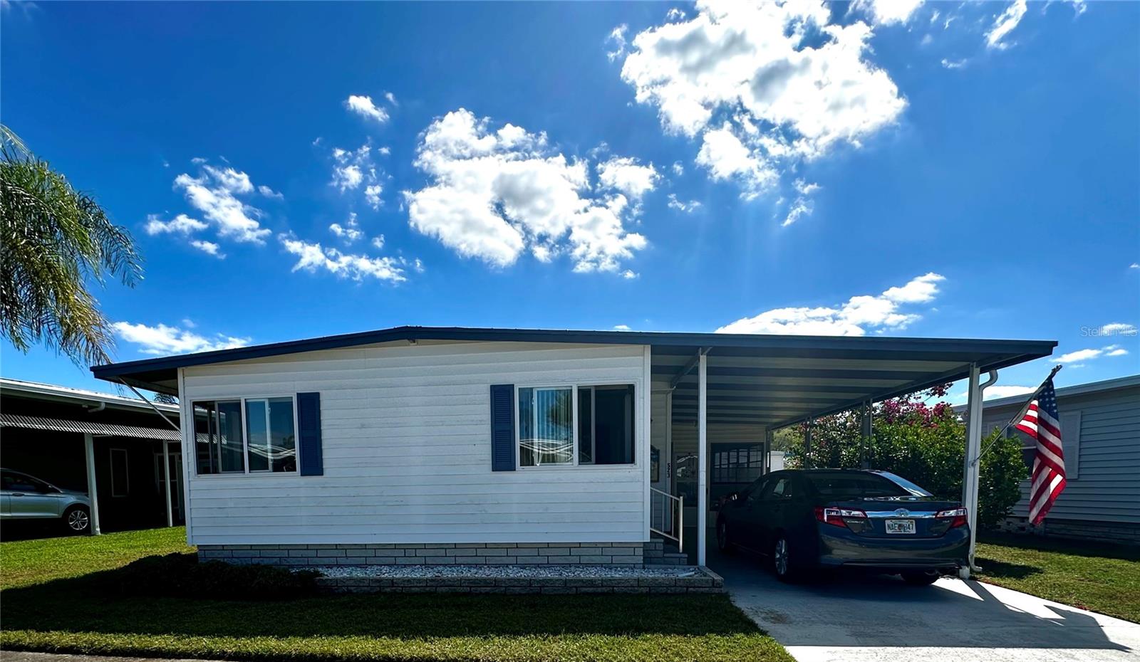 This stunning 2 bedroom, 2 bathroom home, is in one of the most sought after Cooperative ( Resident Owned) golf course communities. Its floor plan has been lovingly updated boasting a newly renovated kitchen with cabinets, appliances, high end solid surface counter tops and under mount sink. Filled with natural light, the kitchen plan flows easily into the dining and living room areas. Need more storage? You'll find it here, with a massive walk-in closet in the master bedrioom, loads of built-ins, to house all those extra winter clothes you brought to Florida but will rarely wear. Enjoy your down time relaxing in the fresh air in the outdoor lanai or the enclosed Florida room. The oversized he/she shed has lots of storage space, built in shelves and a freezer to help with those out of town or drop-in guests. Worried about the Florida summer, don’t be, the new air conditioner will keep you cool all summer long. Fairway Village is a spacious, premier manufactured home community. A perfect place to live your dream, whether you stay year-round or spend some months elsewhere. A 100 percent Resident Owned Community of 751 homes, for persons 55-plus years of age. Located in sunny Largo, just a stones throw away from the Gulf of Mexico and its stunning sandy beaches. We offer a feeling of spaciousness with our wide curbed streets with streetlights and sidewalks. All homes are located with established setbacks from the street. Amenities include: A private 9 hole par 3 golf course with two lakefront fairways and a practice putting green A five-plus acre lake for catch and release fishing, Eight sheltered shuffleboard courts and a new 19,000+ sq. ft. Clubhouse which was completed January, 2022, that includes the following: 700 seat Auditorium/Ballroom, Large commercial kitchen, Stage for chorus and programs, Separate conference rooms, 2 pools, both with hot tubs, Fitness center, Library, Billiard room, Card playing room, Sitting areas, Wi-fi service throughout. Fairway Village's 2025 maintenance fee of $401/month includes water, sewer, in-home high speed internet access, 220+ Spectrum cable TV channels, curbside trash pickup, lawn pest control and lawncare. 2025 Annual Golf memberships are available to residents for unlimited play. Non-members pay a $15 greens fee during season and $8 off season. The Fairway Village Social Committee (FSC) promotes and coordinates over 50 social activities. While the listing information is deemed reliable, please note, it is not guaranteed and should be independently verified for accuracy.