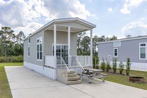 Photo of 325 Tiki Turn (hwy 630) E, Lake Wales, FL 33898 (MLS # TB8495573)