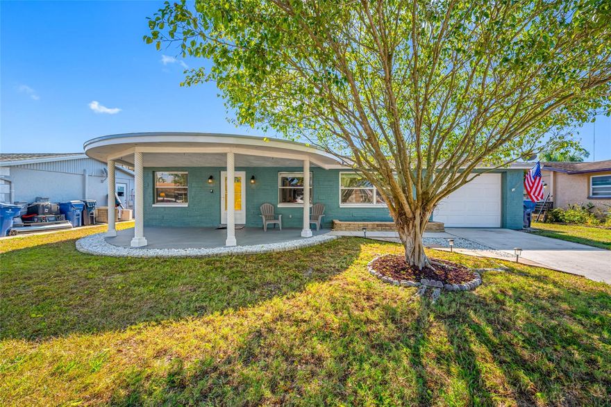 Stunning and thoughtfully updated 3-bedroom, 2-bathroom home with exceptional curb appeal. Fresh exterior paint, lush professional landscaping, and a charming covered front porch create an inviting first impression. Situated on high, dry ground and outside of the flood zone, this home offers peace of mind as well as style. Abundant natural light fills the open living and dining area through expansive windows, highlighting the beautiful neutral tile flooring that flows throughout the home. The tastefully updated kitchen features wood cabinetry, newer stainless steel appliances, and a functional layout ideal for everyday living. The private primary suite is located at the rear of the home and includes its own en-suite bathroom. A generously sized second bedroom easily accommodates a bed plus space for an office, play area, or reading nook. Off the kitchen, a versatile bonus area offers the perfect spot for a breakfast nook or additional workspace. The third bedroom is thoughtfully split from the others, providing comfort and flexibility for guests or family. Step outside to an exceptional backyard designed for relaxation and entertaining. Enjoy both a screened-in porch and an open patio, along with a spacious yard ideal for gatherings, gardening, or play. Additional upgrades include a brand-new roof and updated electrical, offering durability and move-in confidence. Located just minutes from top-rated Gulf beaches, popular shopping, dining, and more! This home offers the perfect blend of comfort, convenience, and coastal living.