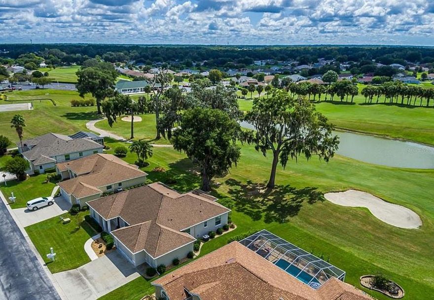 One or more photo(s) has been virtually staged. Large Block Home in desirable Ocala Palms, 2399 square feet…walk up entrance to foyer dining and living area open to the kitchen with a beautiful eat in counter for 4!  Nice wooden cabinets and SS applicants and a coffee counter!  Bonus is the split floor plan primary and en-suite bath on one side with large walk in closet and bedrooms 2 and 3 on the other side of the kitchen small hallway with the second bath in between. Beautiful Florida room with a wet bar…great for reading the paper or playing games walk out to a beautiful million dollar view of the 18th Hole and a water feature Large Grand Oak for shade while grilling dinner or relaxing on the paved patio.  Large 2 car garage and a golf cart bay to boot.  Laundry with cabinets and storage.  We’re open to both a short term and a long term rental.  Owner may consider a pet depending on size and breed.  House is vacant and on a lock box.  Schedule a showing with listing Agent/Lena B.