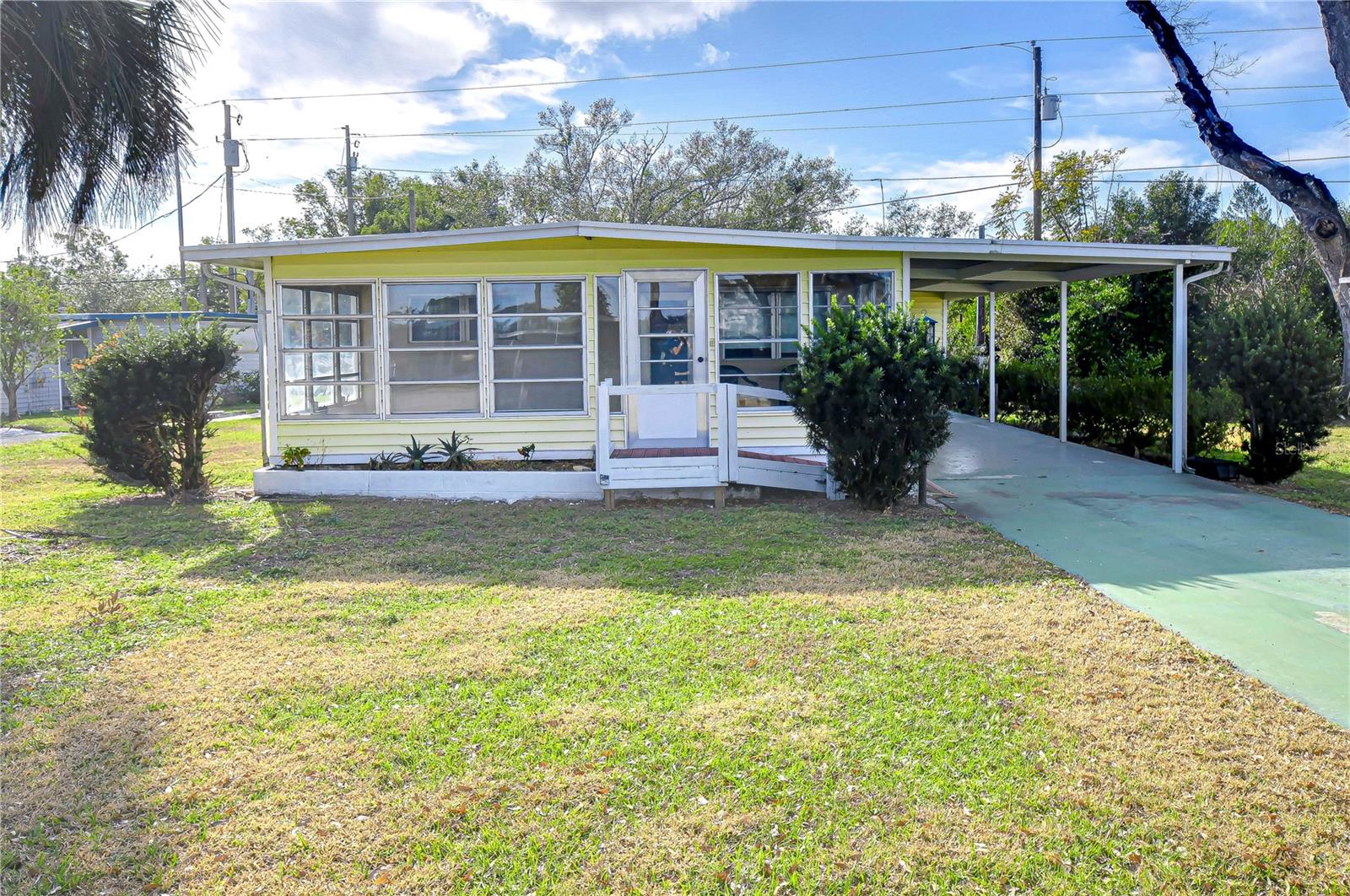 Charming Double-Wide in Green Hills Estates – Corner Lot with a Spacious Florida Room! Nestled in the peaceful sought-after
senior community, this spacious home offers a fantastic layout and endless potential. While it could use a little TLC, the seller has
already made key updates, including new flooring in the living room, plush carpet in the bedroom, and a stylish new vanity in the
bathroom. One of the standout features of this home is the wonderful Florida room, the perfect spot to enjoy your morning coffee
while soaking in the tranquil surroundings. Sitting on a desirable corner lot, this home provides extra space and privacy. Inside, the
flexible floor plan allows you to customize the space to suit your needs—whether you prefer a large open-concept living room, a
combined living and dining area with a spacious kitchen, or a cozy eat-in kitchen with a comfortable living space.
Located in a quiet and friendly 55+ community, Green Hills Estates boasts low HOA fees, a welcoming atmosphere, clubhouse and
social events. If you’re looking for affordable living in the heart of Zephyrhills, this is an opportunity you won’t want to miss. Bring
your vision and make this home your own—schedule a showing today!