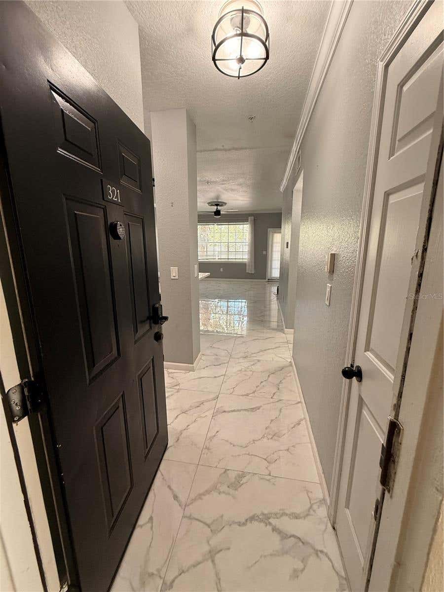 Photo of 2674 Robert Trent Jones Drive #321, Orlando, FL 32835 (MLS # TB8522631)