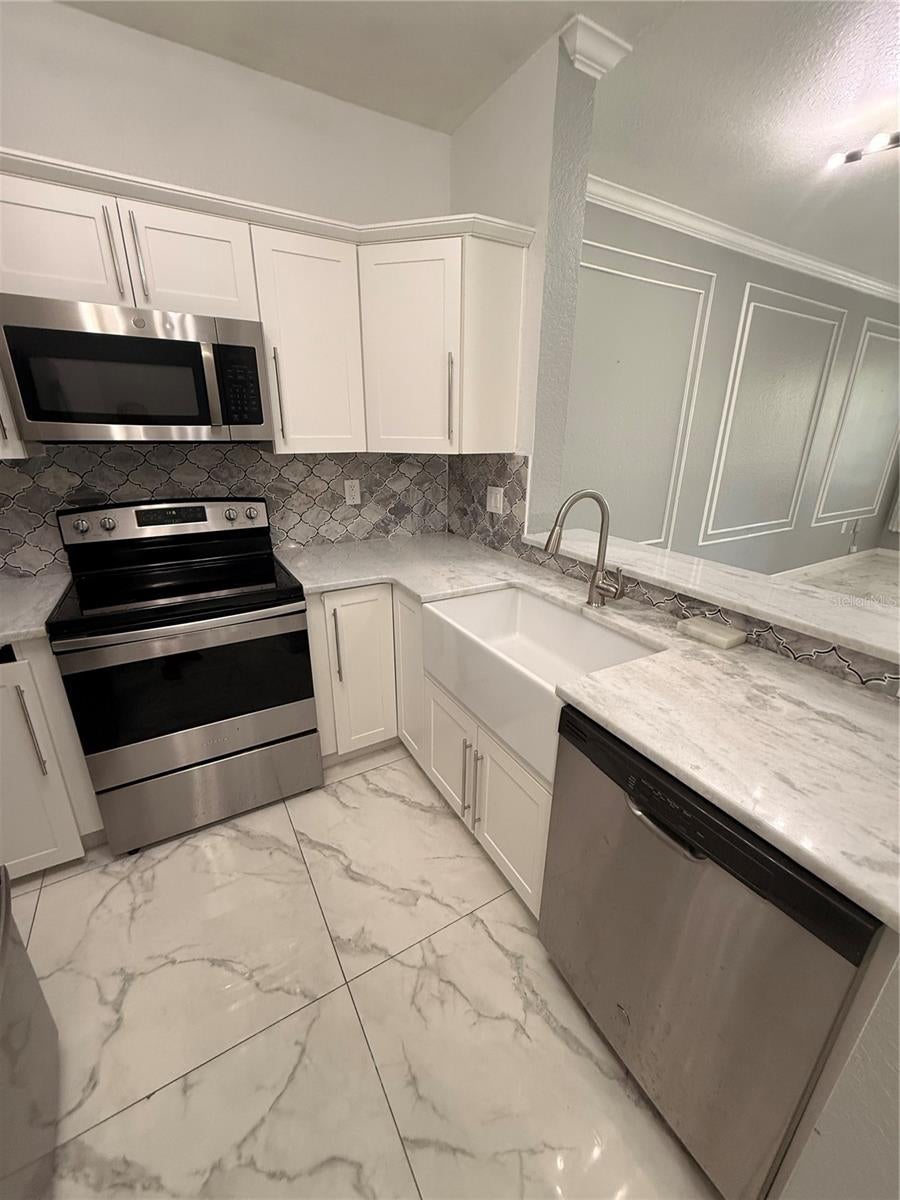 Photo of 2674 Robert Trent Jones Drive #321, Orlando, FL 32835 (MLS # TB8522631)