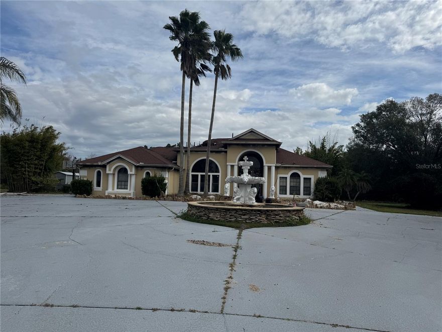 Rare opportunity in Poinciana! This spacious 0.87-acre lot features the remains of a home that was damaged by fire. A few exterior walls and the in-ground pool remain, offering a potential foundation for a rebuild, or the property can be treated as a full tear-down—your choice. The seller is currently cleaning out debris and is willing to sell as-is or deliver the property fully demolished. Perfect for investors, builders, or buyers looking to design a custom home on an oversized lot. A great chance to create value in a growing community! Exterior viewing only due to fire damage. DO NOT ENTER PROPERTY UNSAFE STRUCTURE.