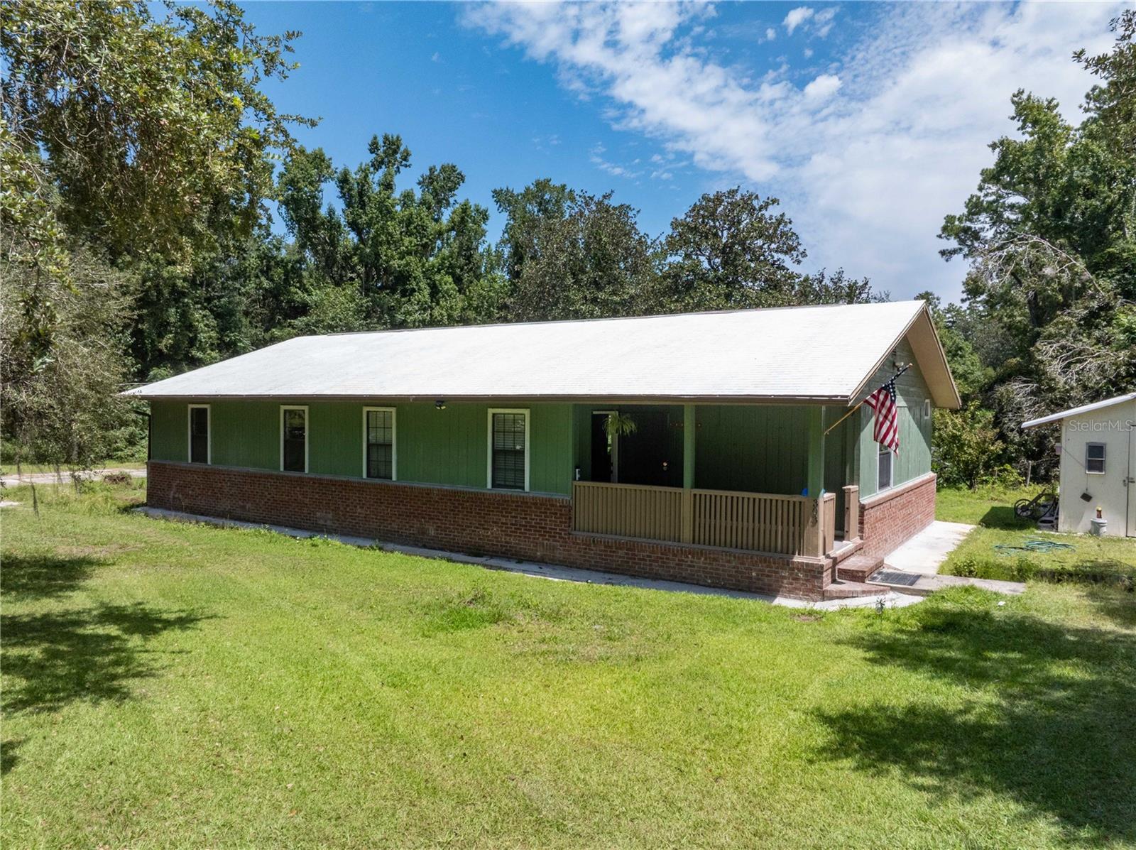 Under contract-accepting backup offers. One or more photo(s) has been virtually staged. Welcome to this charming 3-bedroom, 2-bathroom ranch-style home located in the quiet Parnell Hills Subdivision of Lake City. Set on a spacious 2.52-acre lot, this property offers the tranquility of a rural lifestyle with a perfect blend of open fields, wooded areas, and established landscaping. The home features a shingle roof with protective coating,durable laminate flooring, and classic construction with wood siding and a wood frame. It is served by a private well water source and offers open parking with plenty of room for multiple vehicles.
The expansive lot is well-suited for agriculture, gardening, or even raising poultry, making it an excellent choice for those who enjoy country living. Fruit trees and existing plants add to the charm, while an outdoor wood-burning fireplace creates a cozy space for gatherings or relaxation under the stars. With its peaceful setting, agricultural potential, and spacious layout, this home provides a wonderful opportunity to enjoy privacy and a self-sustained lifestyle, all while remaining within easy reach of Lake City conveniences. Schedule your private showing today!