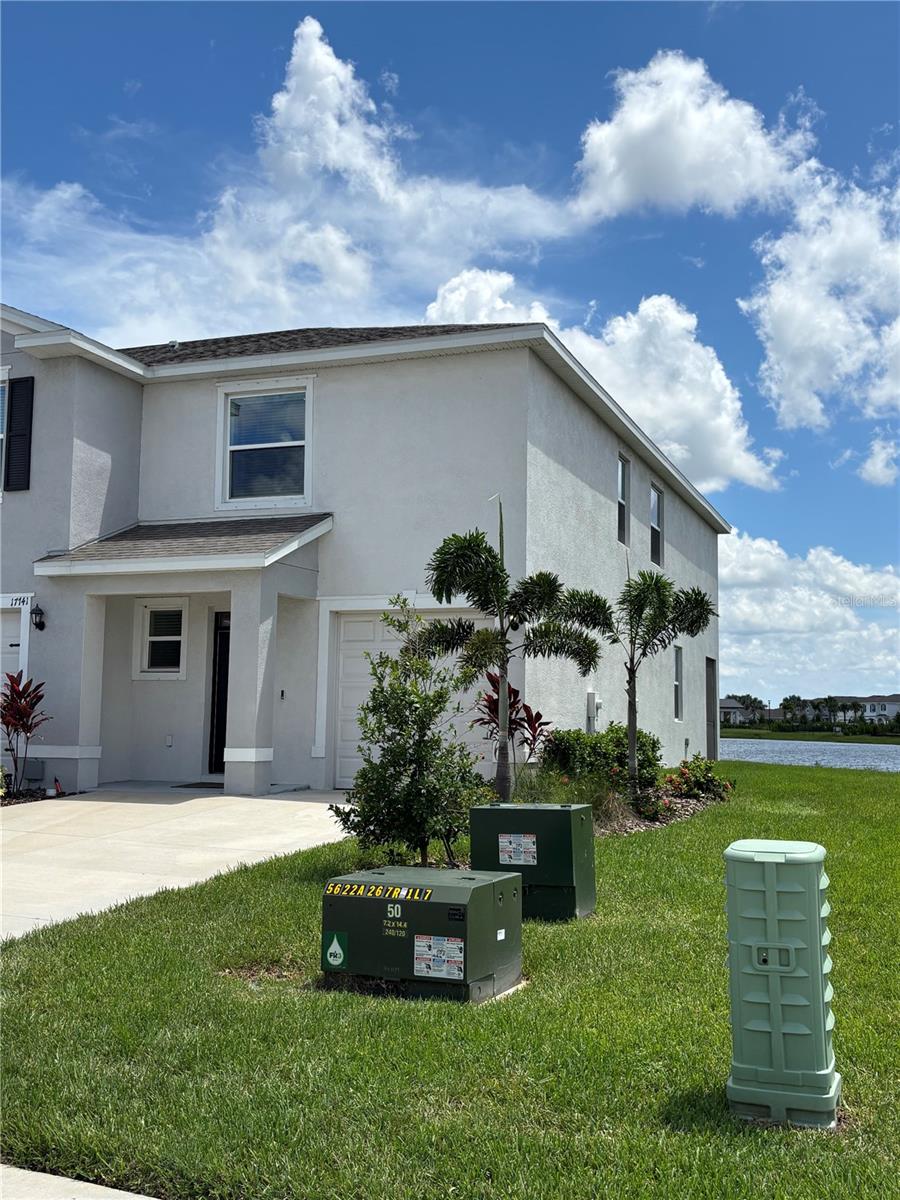 Space and Serenity w/ WATER VIEW! Largest SqFt Townhouse in award winning master planned community of Lakewood Ranch includes 3 Bedrooms, 2.5 bathrooms and LOFT space. This loft space could be an Office or TV room, great for work at home situations. This end unit features block construction on both floors (for cheaper insurance) and only one party wall. This means less neighbor noise and more light in the unit! These size townhouses are SOLD OUT, so DO NOT Miss this one! This unit is complete with granite countertops, SS appliances, tile floors, designer accent walls, and high ceilings. The open first floor plan is great for entertaining and modern living complete with D.R. Horton’s state-of-the-art Smart Home Automation system.The Master bedroom upstairs has a walk-in closet and en-suite bathroom with the washer and dryer conveniently located upstairs. The Star Farms community has picturesque views and includes Resort Club amenity center, Resort Style Pool, Fitness and Athletic Performance Center, Pet Park, Baseball field, Tennis, Pickleball and basketball courts and many other amenities slated to open in the near future. To top it all off, a brand new elementary school is set to open August of 2025 and the Middle school August of 2026. Truly an exceptional place to call HOME!!!!