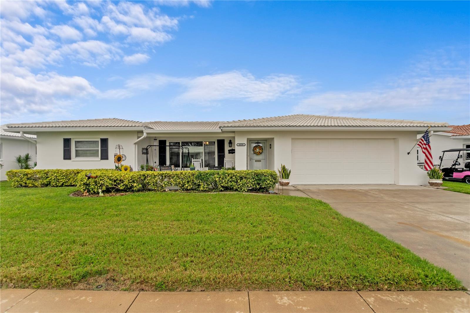 Welcome to this beautifully maintained 2-bedroom, 2-bath home with an oversized 2-car garage and extended driveway, offering over 1,700 sq. ft. of living space. This is one of the few homes in the neighborhood with such a generous floor plan, and it’s loaded with upgrades.
Enjoy your mornings on the 20x11 covered front porch or relax in the brand-new 12x12 screened back porch, perfect for taking in the Florida lifestyle while visiting with neighbors cruising by on their golf carts. Inside, you’ll be greeted with wood-look tile flooring throughout, and the highly desirable Eden floor plan featuring a large living room, two dining areas, and a 30x12 Florida room—ideal for entertaining family and friends.
The updated kitchen includes granite countertops, backsplash, modern faucet, and newer stainless steel appliances. The spacious primary suite boasts an upgraded bathroom and a large walk-in closet. The guest bedroom is equally roomy, with two oversized closets, and the updated guest bath offers comfort for visiting friends and family.
Peace of mind comes with newer hurricane impact windows, a 2023 roof, 2022 water heater, 2018 AC, updated outlets & switches, and attic storage with pull-down stairs.
Mainlands of Tamarac by the Gulf is a vibrant 55+ community surrounded by a golf course and offering endless activities, including seven clubhouses, pools, and shuffleboard courts. The Unit 4 clubhouse is within walking distance and features a large heated pool and plenty of social events. The HOA makes life easy, covering roof replacement and repair, cable, internet, water, sewer, garbage, irrigation, lawn care, and exterior paint.
Centrally located in Pinellas County, you’re close to both Tampa & St. Pete airports, award-winning beaches (10–12 miles away), shopping, dining, and entertainment.
And the best part—this home did NOT flood!
If you’re ready to retire or looking for the perfect second home, this one is a must-see. Schedule your private tour today!