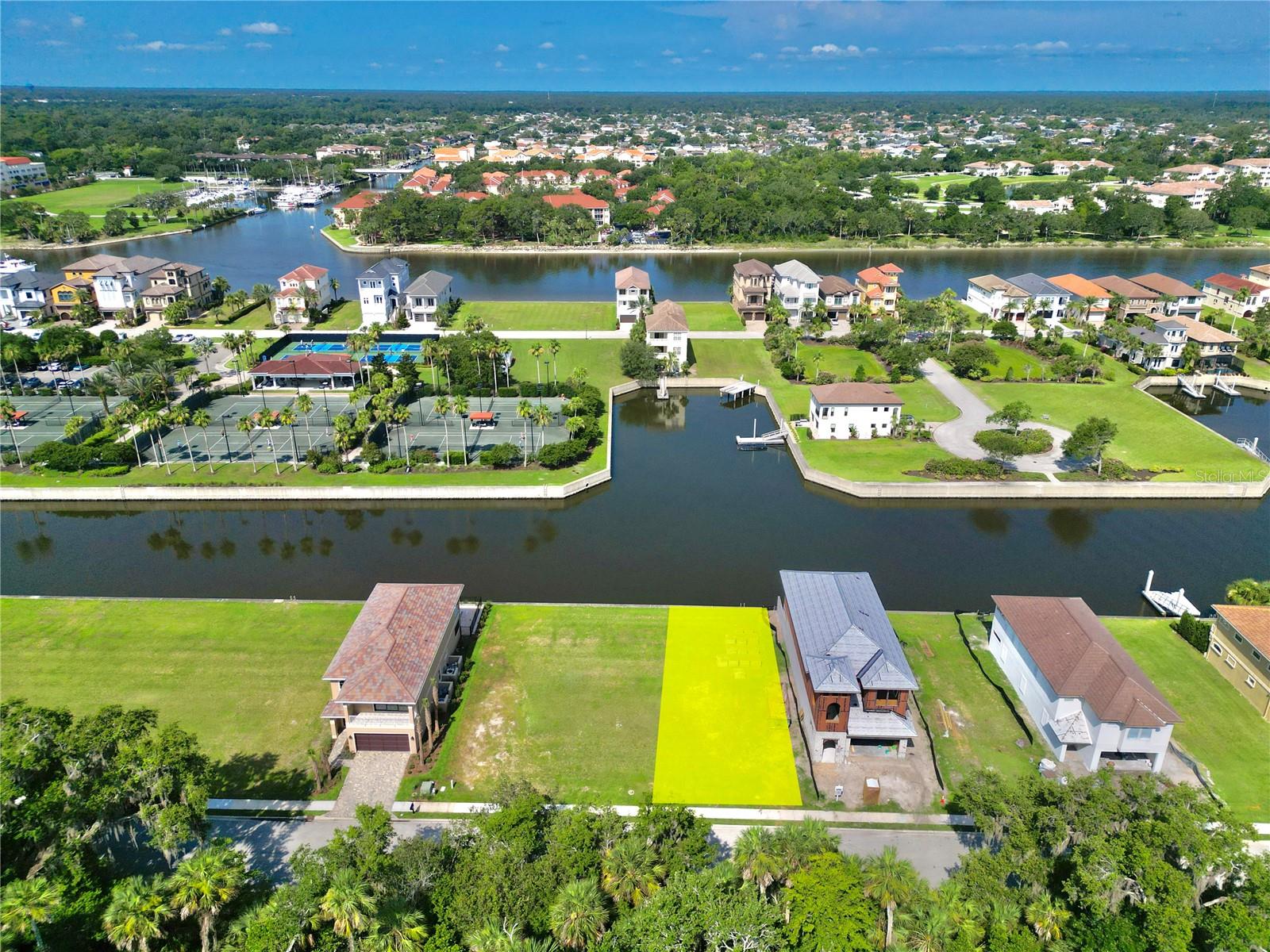 Build your Florida waterfront dream home on this Premier deep salt water lot in Yacht Harbor Village. Only 2000' to the ICW & 2000' feet more to boating gas station. 20 minute boat ride north to Matanzas Inlet leading to the Atlantic Ocean. Very private lot w/ a 15 acre preserve across the street. A boaters paradise w/ a large seawall ready for your dock & boat in your backyard. Flood Zone "X" (flood insurance not required). Less than 1 mile to beach out the private gate at Jungle Hut Road. Land is cleared, flat and ready to build. The custom homes in this community are second-to-none. We have access to some amazing floorplans to consider your new build. The sunset views are amazing from this lot with tons of wildlife including dolphins, manatees, abundant varieties of fish and birds. Owners have the option of joining the Hammock Beach Golf & Resort, only 1 mile away from lot, which also includes access to the Conservatory Golf Club & Yacht Harbor Village Club. 3 private clubs for one low price. 10 pools, private beach access, 2 championship golf courses (1 oceanfront), a world class spa, state-of-the-art fitness center, fantasy pool complex with a lazy river, waterslide, tennis courts, mini golf, 8 different restaurants and so much more.