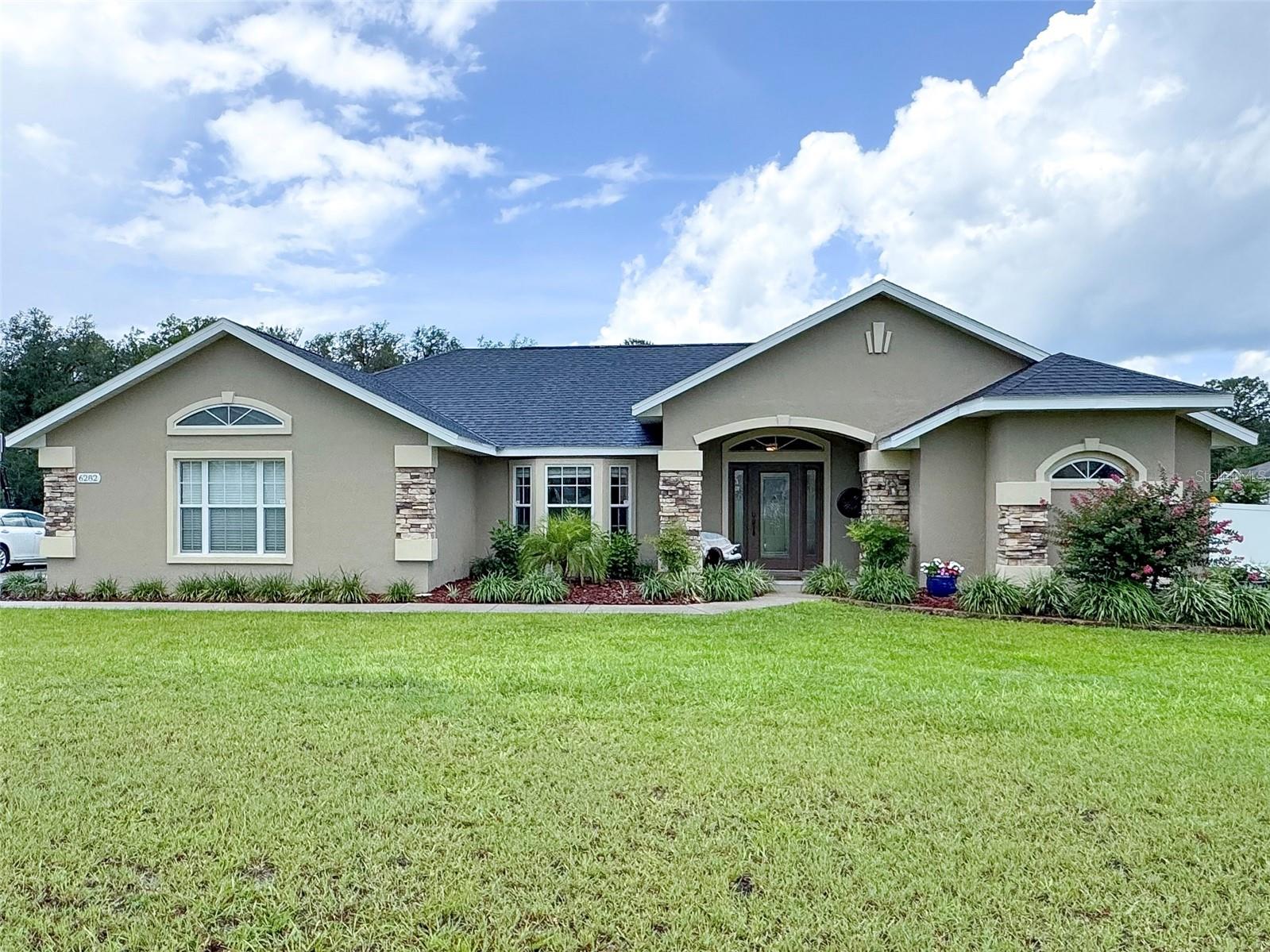 Step into this beautifully appointed 3-bedroom, 3-bathroom home. The perfect blend of luxury and comfort. Nestled in the gated subdivision of Silver Meadows North, on just over an acre of lush land. Boasting two spacious master suites—both with breathtaking views of the screened-in pool—this home is designed for relaxation and elegance. The open concept floor plan creates a seamless flow throughout, inviting natural light to fill the space. Accentuated by ceilings up to 13 feet that enhance the sense of space adding an extra layer of elegance and grandeur. Whether you're entertaining guests or enjoying peaceful evenings by the pool, this home offers the ideal setting for Florida living at its finest.