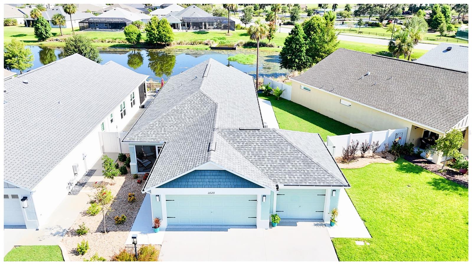 This ONE-OF-A-KIND CONCRETE BLOCK & STUCCO COURTYARD VILLA in Marsh Bend is a RARE FIND that checks EVERY BOX buyers are searching for in The Villages. Built in 2020, this home features a MASSIVE TRUE 3-CAR GARAGE with EPOXY FLOORING—an extremely HARD-TO-FIND UPGRADE in any villa, offering room for vehicles, golf carts, storage, and more.
Inside, the OPEN FLOOR PLAN is finished with LUXURY VINYL PLANK FLOORING throughout—NO CARPET ANYWHERE—and highlighted by CROWN MOLDING and CUSTOM WINDOW CORNICES that elevate the living space. The kitchen delivers on every detail, including QUARTZ COUNTERTOPS, SAMSUNG STAINLESS STEEL APPLIANCES, UNDER-CABINET LIGHTING, TILE BACKSPLASH, and UPGRADED CABINET PULLOUTS in both the kitchen and pantry—BUILT FOR FUNCTION and STYLE.
Step through the sliding doors and enter your own PRIVATE OUTDOOR RETREAT. The EXPANDED SCREENED LANAI offers ROOM TO ENTERTAIN and UNWIND, and includes a HIGH-END HOT TUB with peaceful WATER VIEWS overlooking a RETENTION POND. Whether it’s morning coffee or evening relaxation, this view never gets old. The FENCED SIDE YARD provides additional privacy and has ROOM TO ADD A POOL OR BIRDCAGE—making this home as future-ready as it is move-in ready.
Located DIRECTLY ACROSS FROM THE LOWLANDS EXECUTIVE GOLF COURSE and the MARSH VIEW PITCH & PUTT, this property offers instant access to GOLF, WALKING TRAILS, and RECREATION, all just steps from your front door. Built with quality, packed with RARE FEATURES, and positioned in one of the most desirable corners of The Villages, this home is a STANDOUT.
DO NOT WAIT, homes with this combination of LOCATION, SPACE, AND UPGRADES RARELY LAST. Schedule your private showing TODAY. Furnishings are optional through the owner.