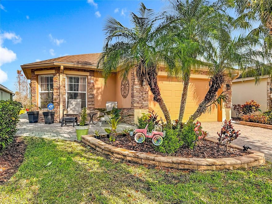 Open concept FURNISHED stone front Bordeaux model has vaulted ceilings with a sweeping waterfront view which gives the ambiance you are looking for in a Florida home.  The Great Room & adjoining Dining Room allow you to entertain on the over 500 Sq.Ft. covered & open screened lanai. A Primary Suite with views to the water is a king-sized room with adjoining bathroom that has a shower with two seats, dual closets, large vanity & private access to lanai.  The second bedroom & adjacent bath with shower & tub is perfect for guests. The den is a multipurpose room that can function as an extra bedroom, office or media room. This home also has a custom front 15.5 x 13.5 stone patio making entertaining anywhere in this home easy & fun! The large kitchen & dinette area is perfect for 2 chefs & has stainless steel appliances with plenty of counter space. An inside laundry with access to the garage that fits a full-sized car & golf cart as well as a workshop features epoxy flooring, pulldown stairs & beverage refrigerator.  The home features a 2023 HVAC, 2015 HWH & 2016 Roof.  Solivita is an active adult 55+ community located in Poinciana, Florida. It is approximately 50 minutes from Disney World & Orlando International Airport. Solivita has a total of 5,470 homes. Enjoy your active years in this paradise. Solivita's  amenities include a softball diamond & field - 36 holes of championship golf that can be played by joining the Stonegate Golf Club or paying as you go - 2 State of the Art Amenity Centers with updated exercise equipment, yoga studio & meeting rooms - 3 restaurants - 14 heated pools - 17 pickleball courts - 9 tennis courts - 4 bocce ball courts - 4 shuffleboard courts - 3 horseshoe pits - a billiards room - miles of bike paths - 2 dog parks (Small & Large Dogs) - Corn Hole - Tot Lot playground – community garden - over 250 resident clubs. The HOA: - maintains the LANDSCAPING & IRRIGATION systems in the common areas as well as at individual homesites - maintains the roads throughout the community - PROVIDES SECURITY with gate guards and mobile patrols including the Polk County Sheriff - allows AUTOMATED GATE ACCESS for residents via license plate readers - provides residents with Fiber Optic Internet & TV service. Poinciana Lakes Plaza is a new shopping center directly across from the Solivita Main Gate. It features Sprouts Grocery, TJ MAXX, Ross, Burlington, Rack Room Shoes, 5 Below, Ulta, Outback, First Watch, 5 Guys, Panda Express, Bojangles, Jersey Mike's Subs, 5 Guys, Papa John's Pizza, Burrito Bar, Cold Stone Creamery, Urgent Care, Dentist, Hand & Stone Massage, America's Best Eyeglasses, Crunch Fitness, Hair Cuttery, Petco, TD Bank, Verizon Mobile, PLUS MORE TO COME. A 2022 STAR Sirius 5 4-seater GOLF CART with a lithium battery is available for sale under separate contract. This home offers move in ready convenience, just pack your clothes & come to Solivita!